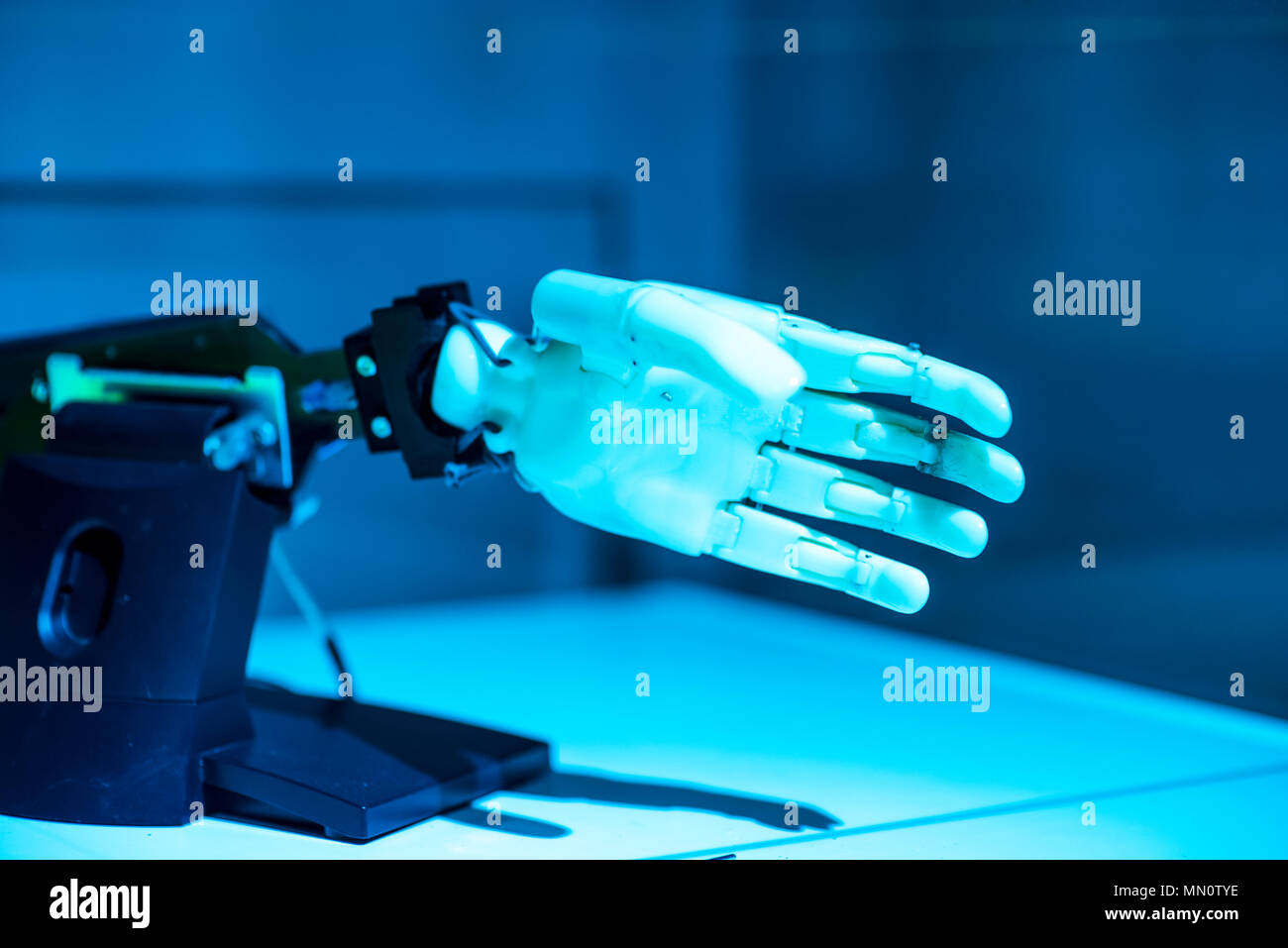 plastic robot hand with open palm gesture Stock Photo