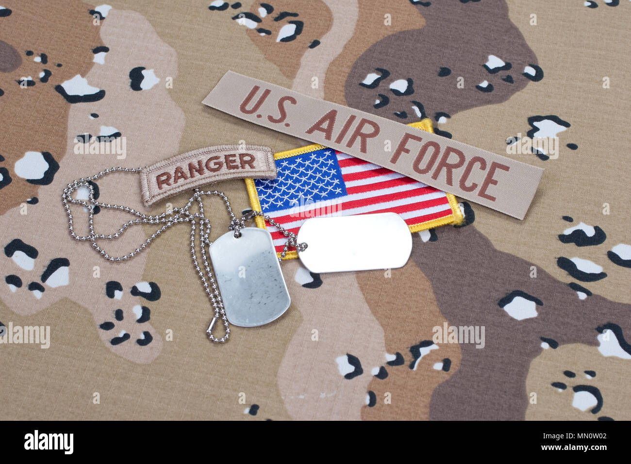 US ARMY ranger tab with blank dog tags on camouflage uniform Stock ...