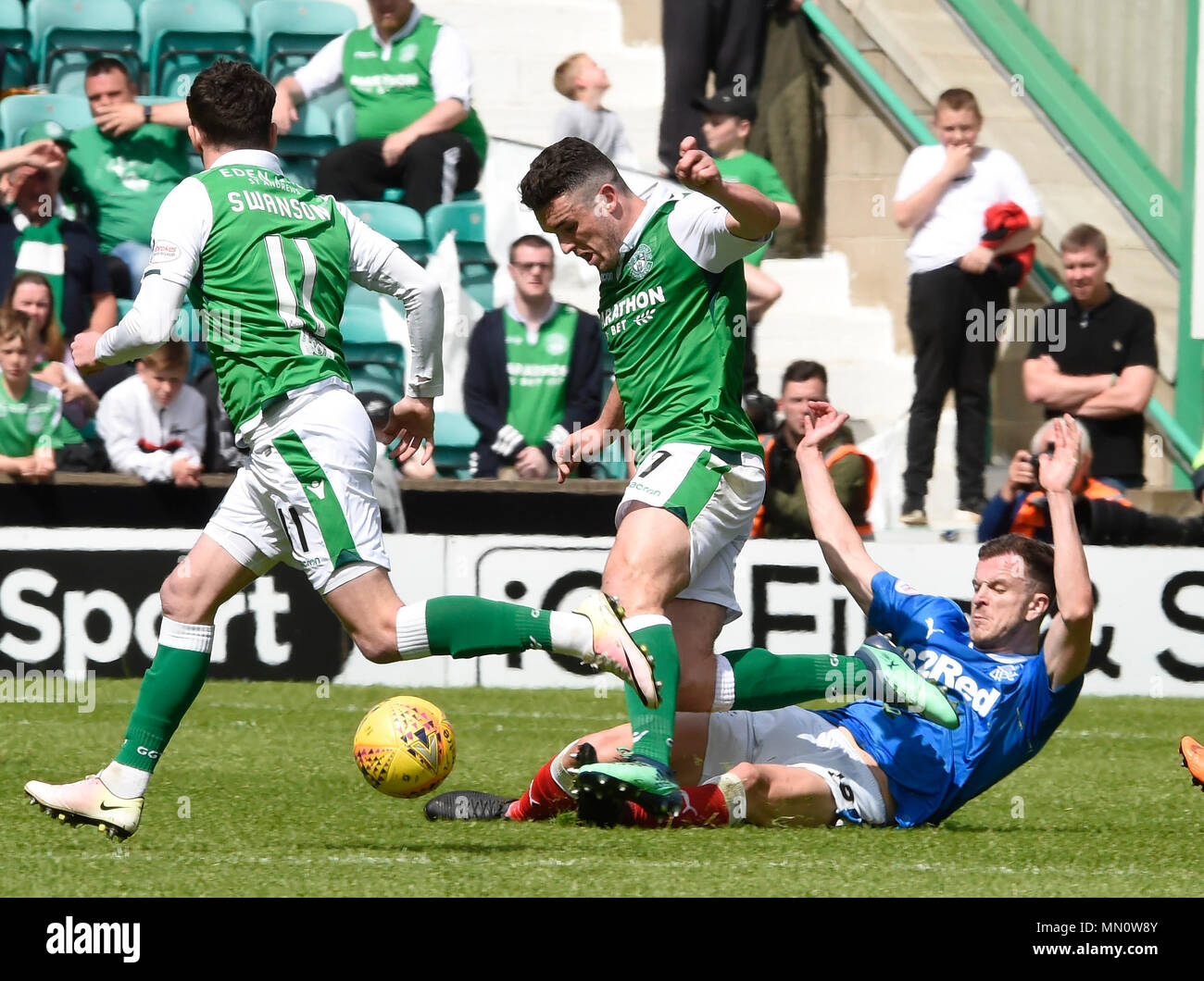 Hibernian's  John McGinn is brought down by Rangers Andy Halliday during the Ladbrokes Scottish Premiership match at Easter Road, Edinburgh. PRESS ASSOCIATION Photo. Picture date: Sunday May 13, 2018. See PA story SOCCER Hibernian. Photo credit should read: Ian Rutherford PA Wire. RESTRICTIONS: EDITORIAL USE ONLY Stock Photo