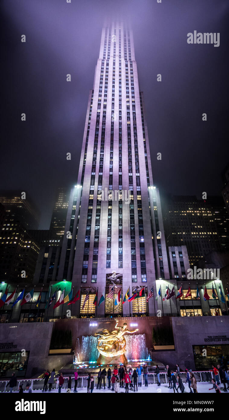 New York, US - March 30, 2018: People at the Rockfeller center ice rink at night in New York city Stock Photo