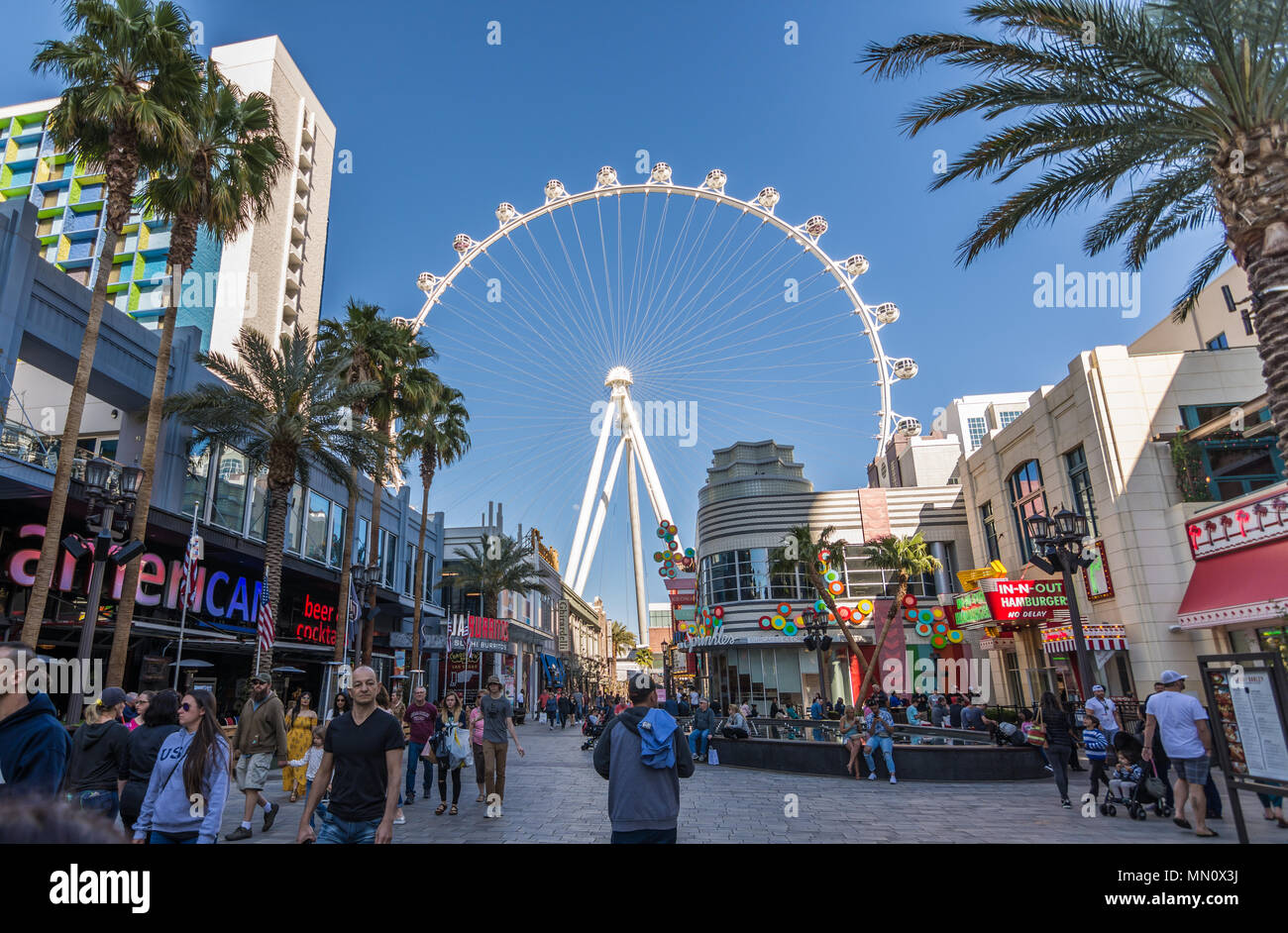 Las Vegas, US - April 27, 2018: Tourtists visting the LInq promenade in Las Vegas as seen on a sunny day Stock Photo