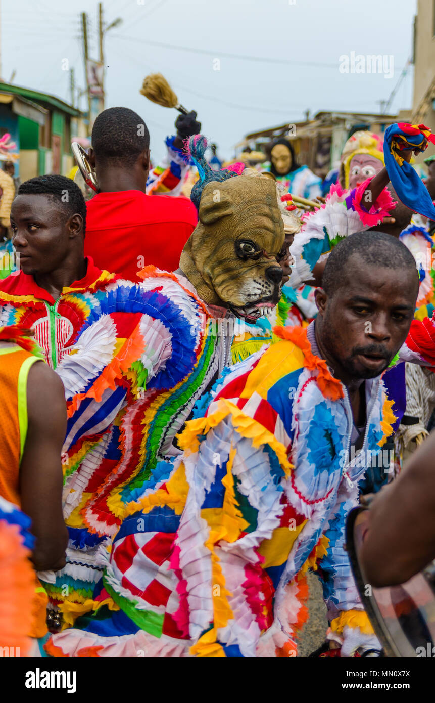 Cape Coast, Ghana - February 15, 2014: Colorful masked and costumed dancers during African carnival festivities Stock Photo