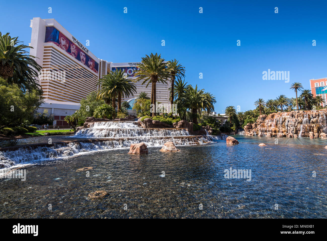 Las Vegas, US - April 26, 2018: Fountains and the famous Mirage hotel in Las Vegas as seen on a sunny day Stock Photo