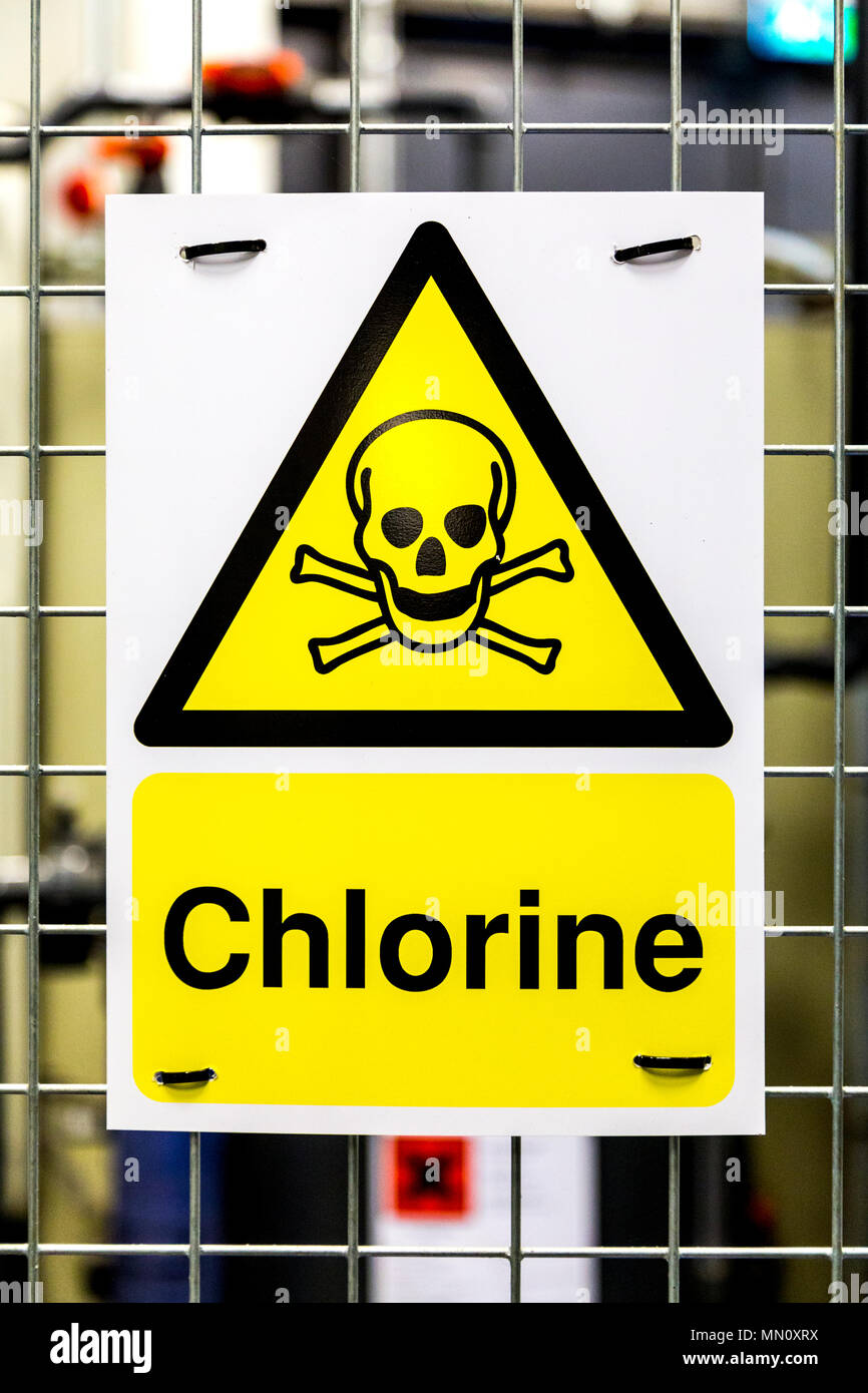 Toxic hazard danger yellow triangle sign with a skull and crossbones for chlorine Stock Photo