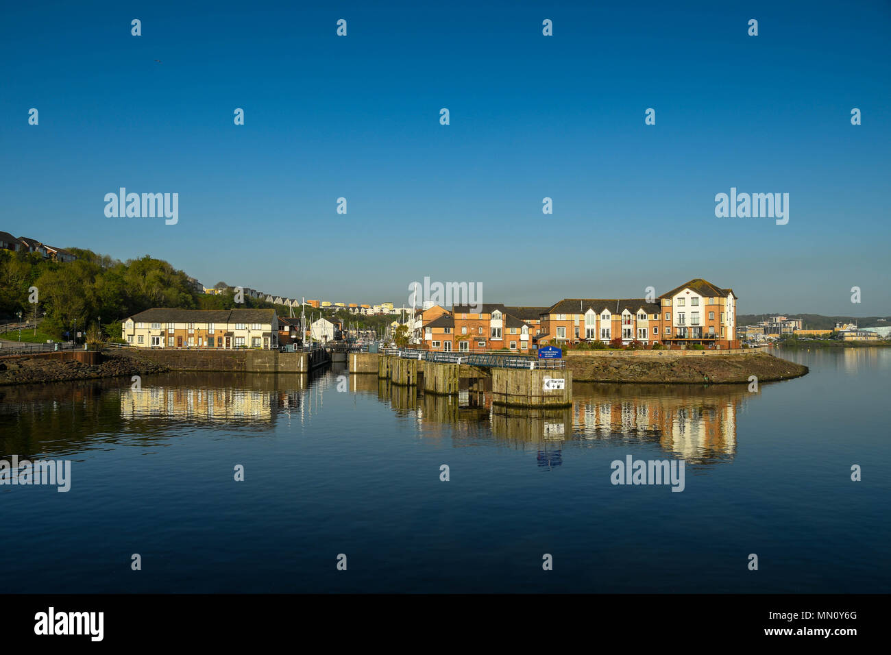 The entrance to Penarth Marina with new houses and apartment blocks on the waterfront Stock Photo