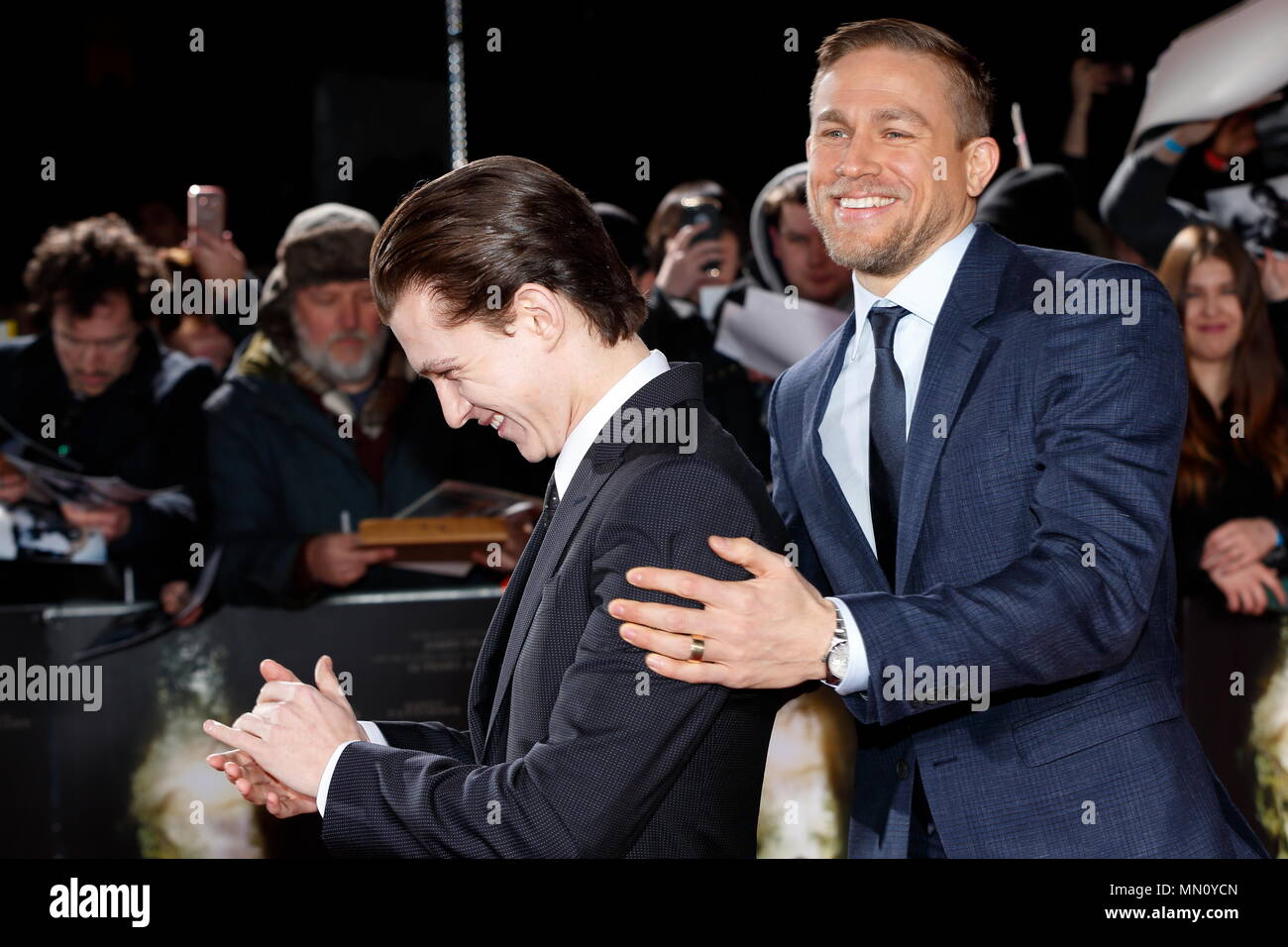 LONDON, ENGLAND - FEBRUARY 16: Charlie Hunnam who plays Percy Fawcett has fun with Tom Holland on the red carpet at The Lost City of Z UK premiere on February 16, 2017 in London, United Kingdom. Stock Photo