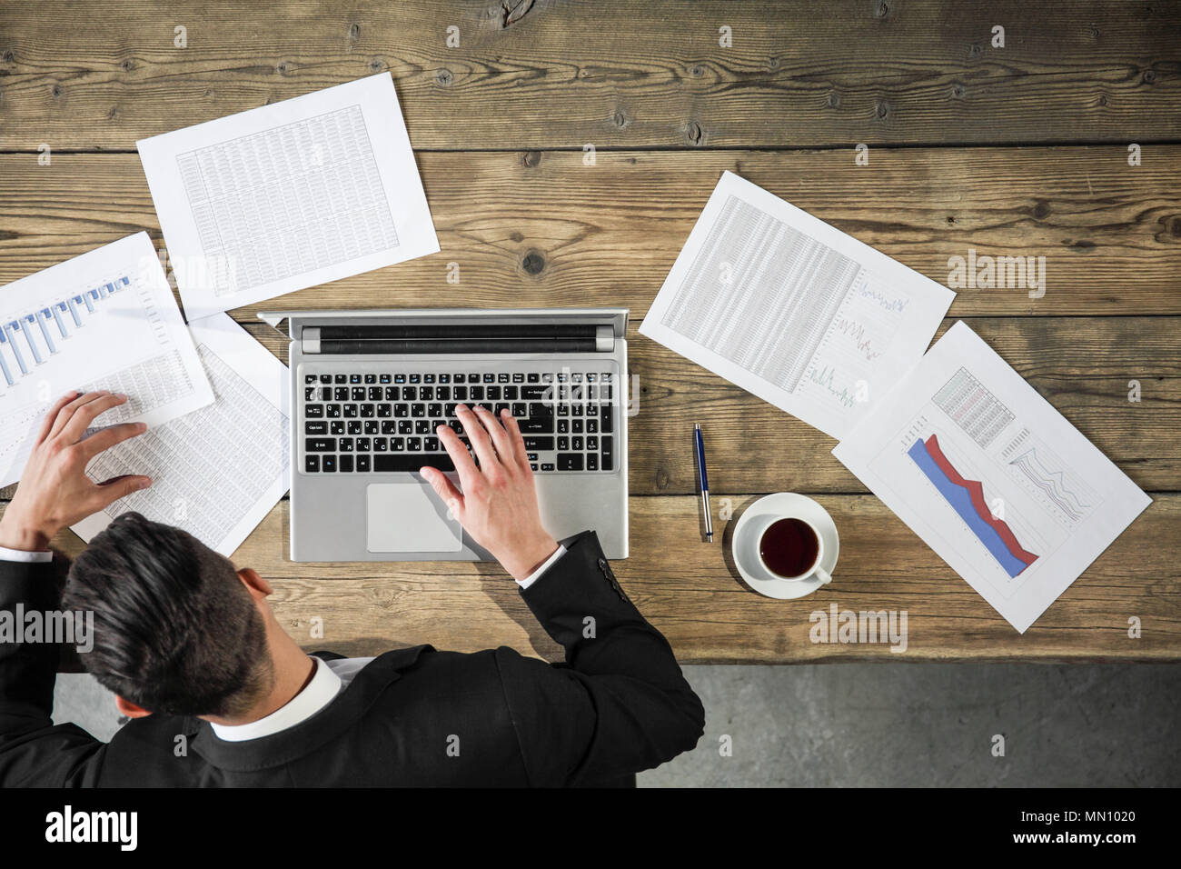 Business man working with laptop and statistics data Stock Photo