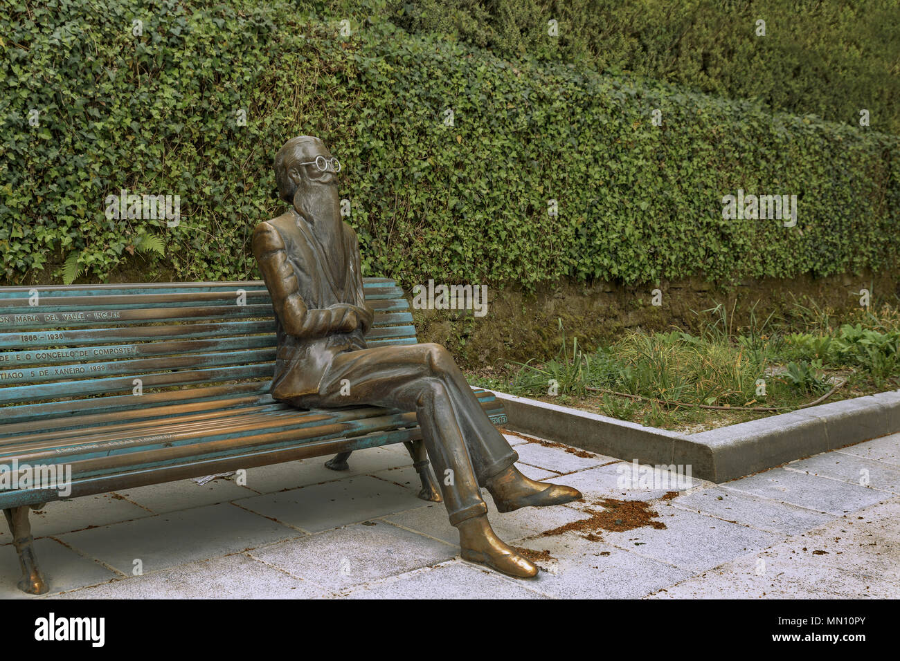 Statue of Valle Inclan sitting on the bench of Parque de la Alameda in Santiago de Compostela, province of A Coruña, region of Galicia, Spain, Europe Stock Photo
