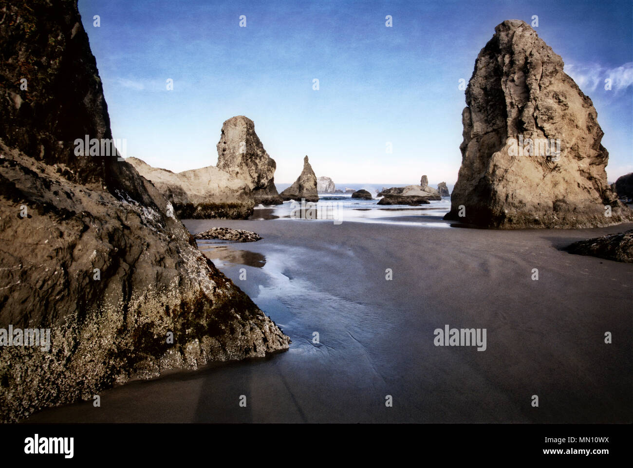 The stacks at Bandon State Natural Area exposed by low tide. Oregon. Stock Photo