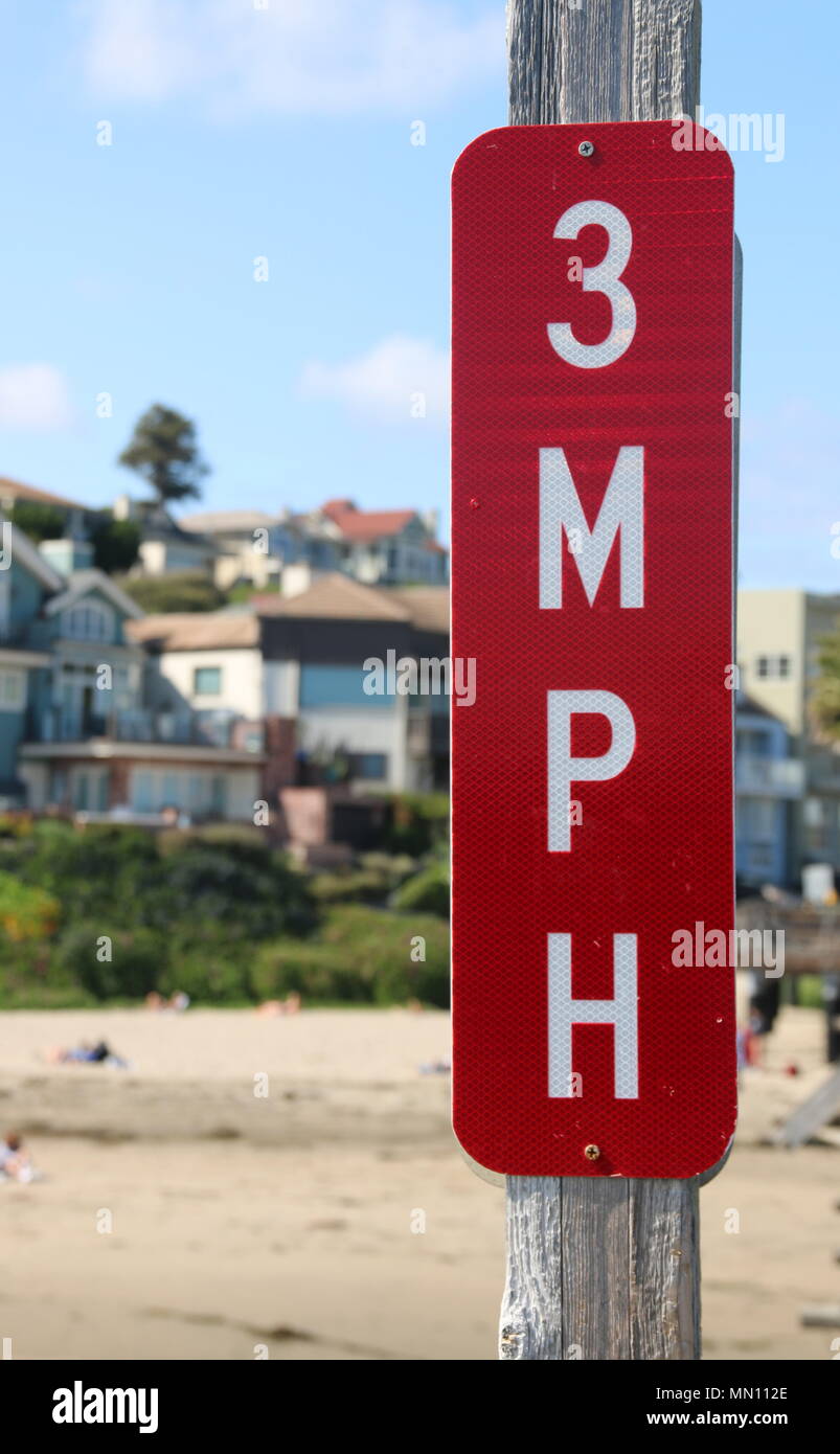 Road sign, 3 mph, posted on the pier at Capitola Beach, CA. Stock Photo