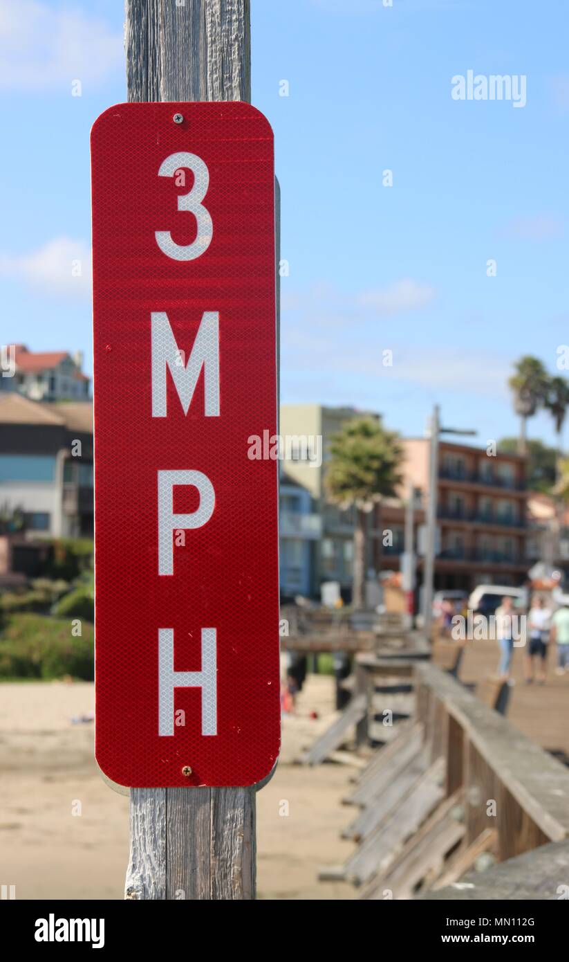 Road sign, 3 mph, posted on the pier at Capitola Beach, CA. Stock Photo