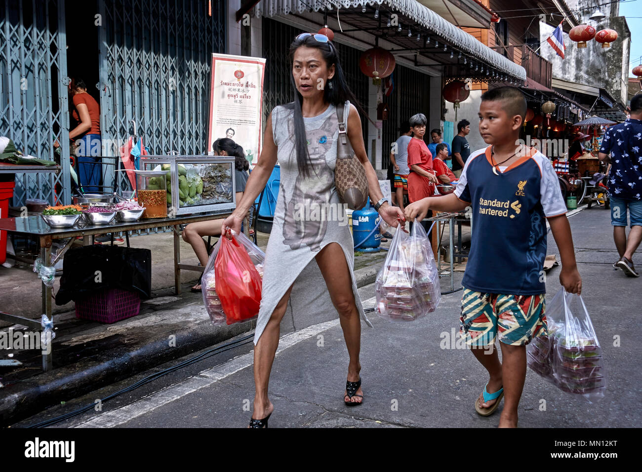 Woman wearing leg revealing split skirt. Thailand Southeast Asia Stock Photo