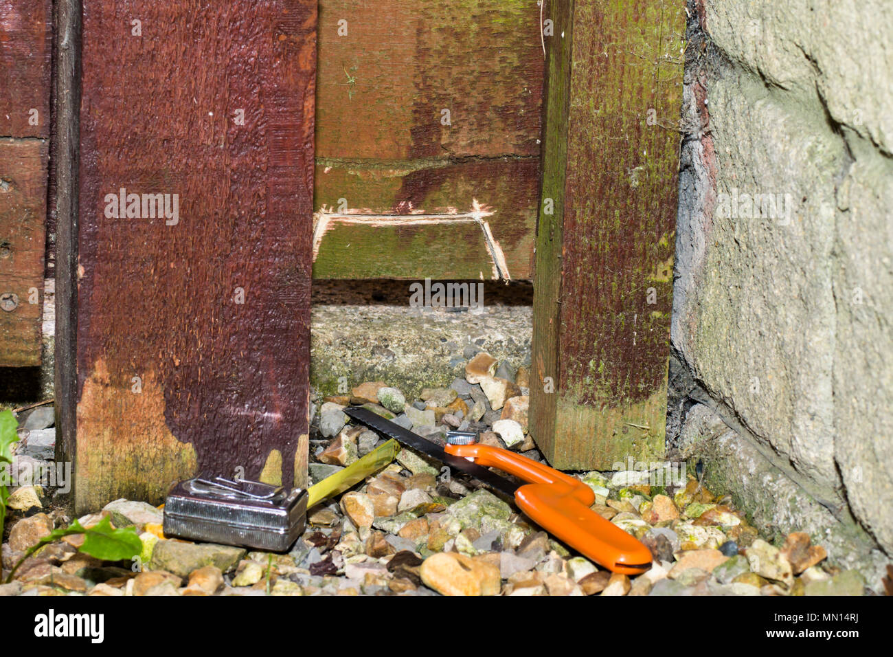 Cutting hole fence hires stock photography and images Alamy
