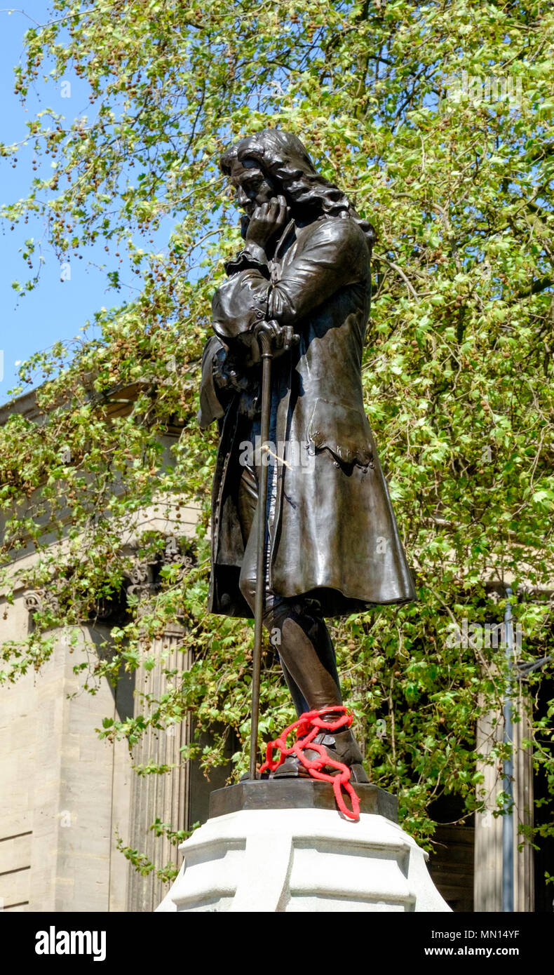 The Statue of Edward colston in the center of Bristol. Chains have been added to show his involvement with the historical slave trade Stock Photo