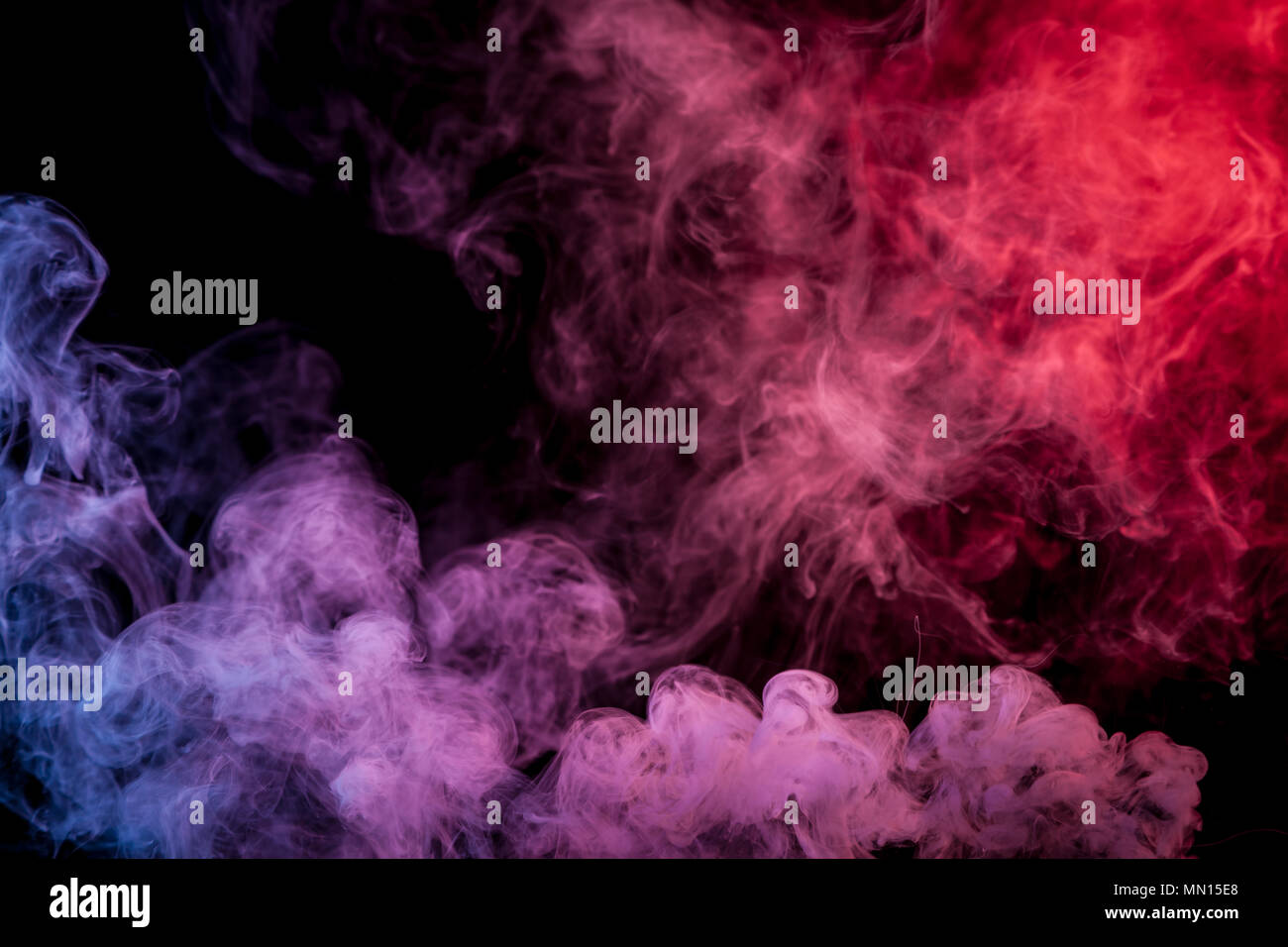 Red and blue smoke on black background Stock Photo - Alamy