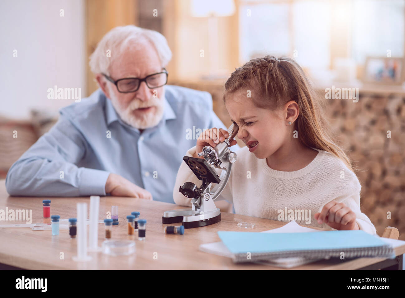 Nice young girl using the microscope Stock Photo