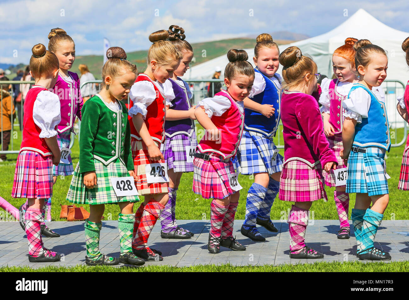 Gourock, UK. 13th May 2018. Gourock starts off the 'Games' season with hundreds of pipers, 'heavies' and dancers from across the country, all competing in traditional Scottish Highland Games that include pipe bands, individual piping, country dancing for all ages and all the traditional heavyweight competitions such as tossing the caber, throwing the hammer and lifting the Keppoch Stone.Thousands of spectators turned out on a fine sunny May Sunday to cheer on all the competitors. Credit: Findlay/Alamy Live News Stock Photo