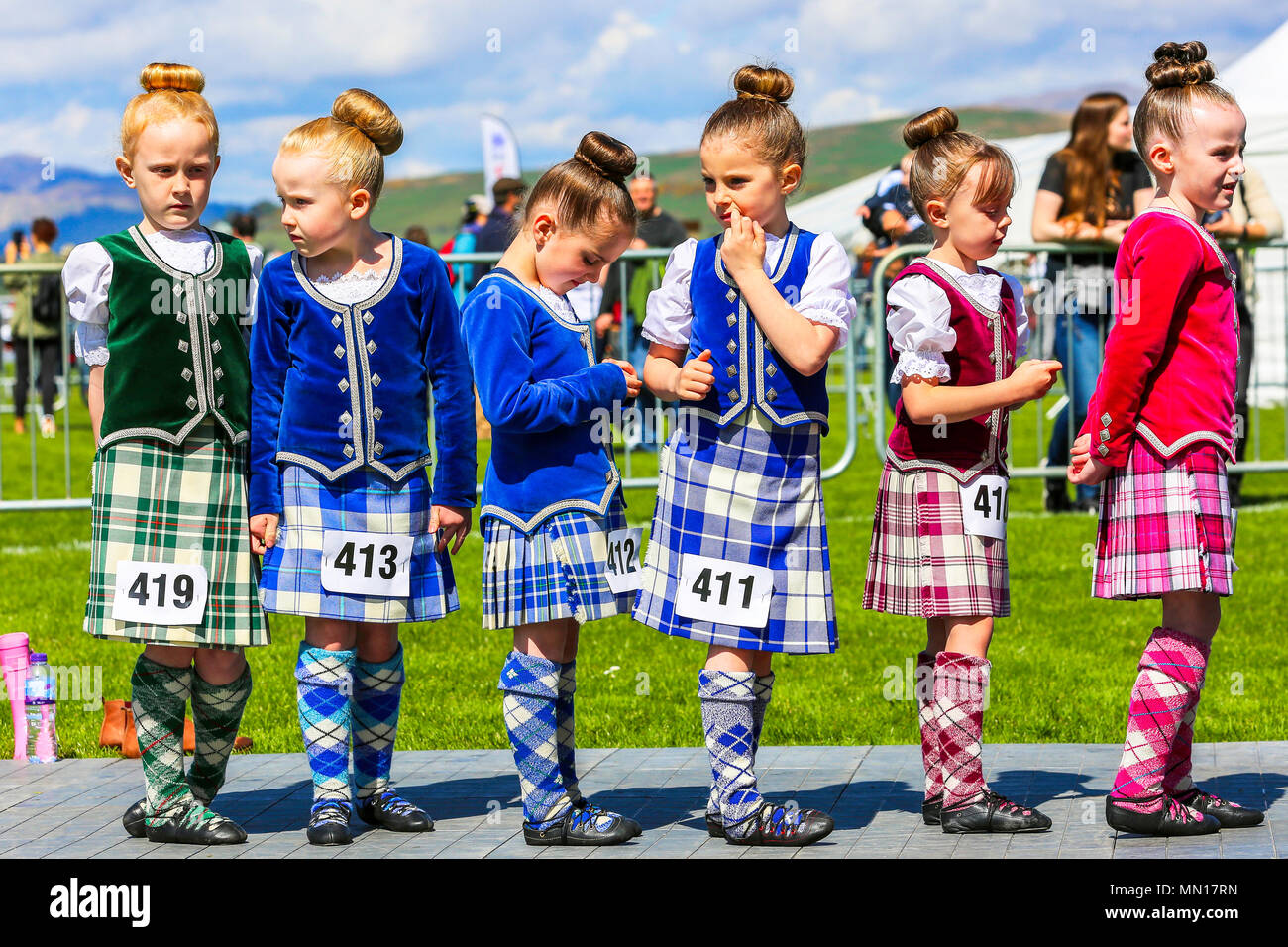 Gourock, UK. 13th May 2018. Gourock starts off the 'Games' season with hundreds of pipers, 'heavies' and dancers from across the country, all competing in traditional Scottish Highland Games that include pipe bands, individual piping, country dancing for all ages and all the traditional heavyweight competitions such as tossing the caber, throwing the hammer and lifting the Keppoch Stone.Thousands of spectators turned out on a fine sunny May Sunday to cheer on all the competitors. Credit: Findlay/Alamy Live News Stock Photo