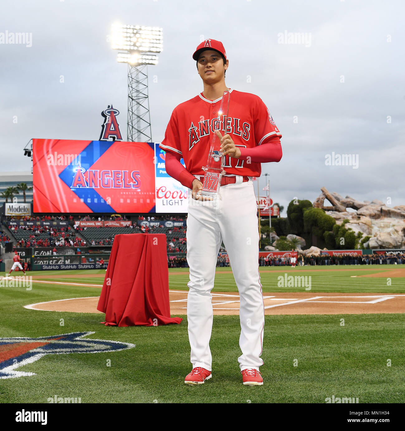 Shohei Ohtani of the Los Angeles Angels receives the American League Rookie of the Month for April award trophy before the Major League Baseball game against the Minnesota Twins at Angel Stadium
