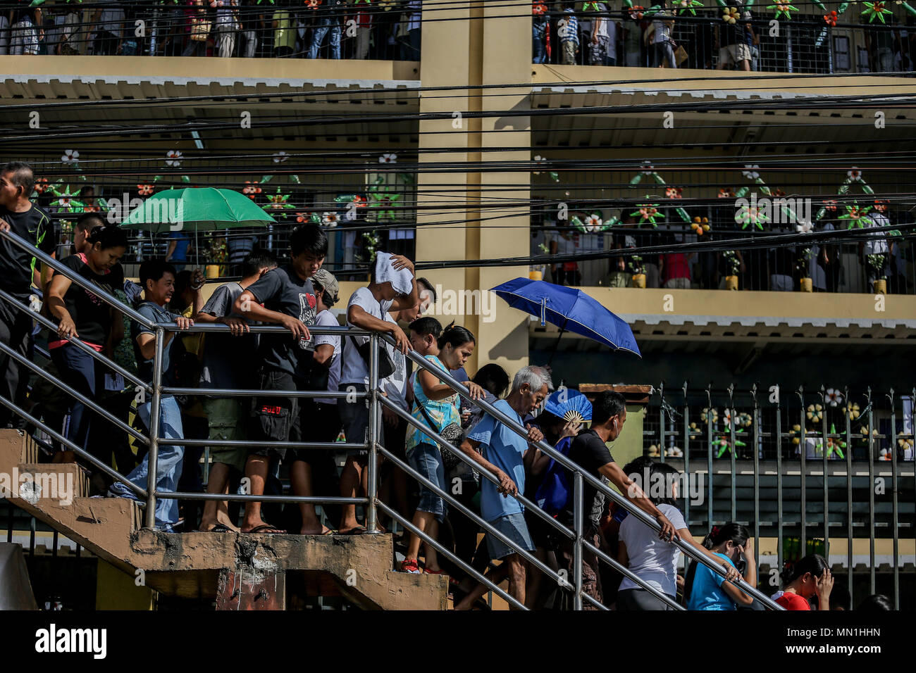 Quezon City, Philippines. 14th May, 2018. Voters line up at Pres. Corazon Aquino Elementary School in Bataasan Hills, Quezon City on Monday. May 14, 2018. Millions of Filipino voters flock to schools turned into voting centers nationwide for the Baragay and Sangguniang Kabataan elections. Credit: Basilio H. Sepe/ZUMA Wire/Alamy Live News Stock Photo