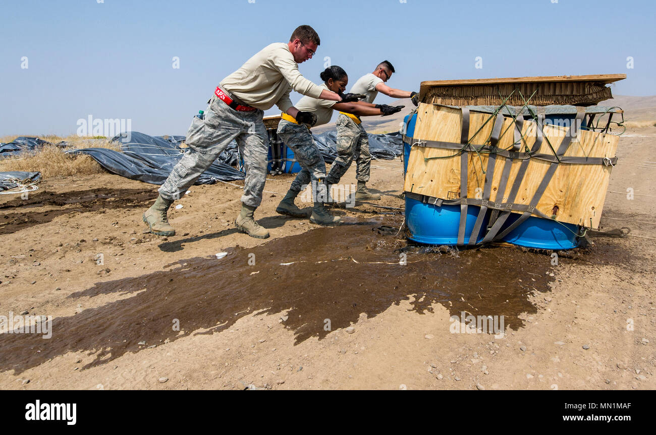 U.S. Air Force Airmen recover Container Delivery System (CDS) cargo