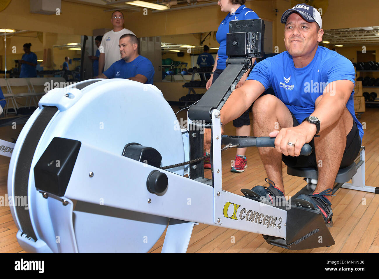 U.S. Air Force Master Sgt. Israel Delgado uses a rowing machine during the  Air Force Wounded Warrior Program's Warrior Care Event inside the Offutt  Field House gym on Offutt Air Force Base,