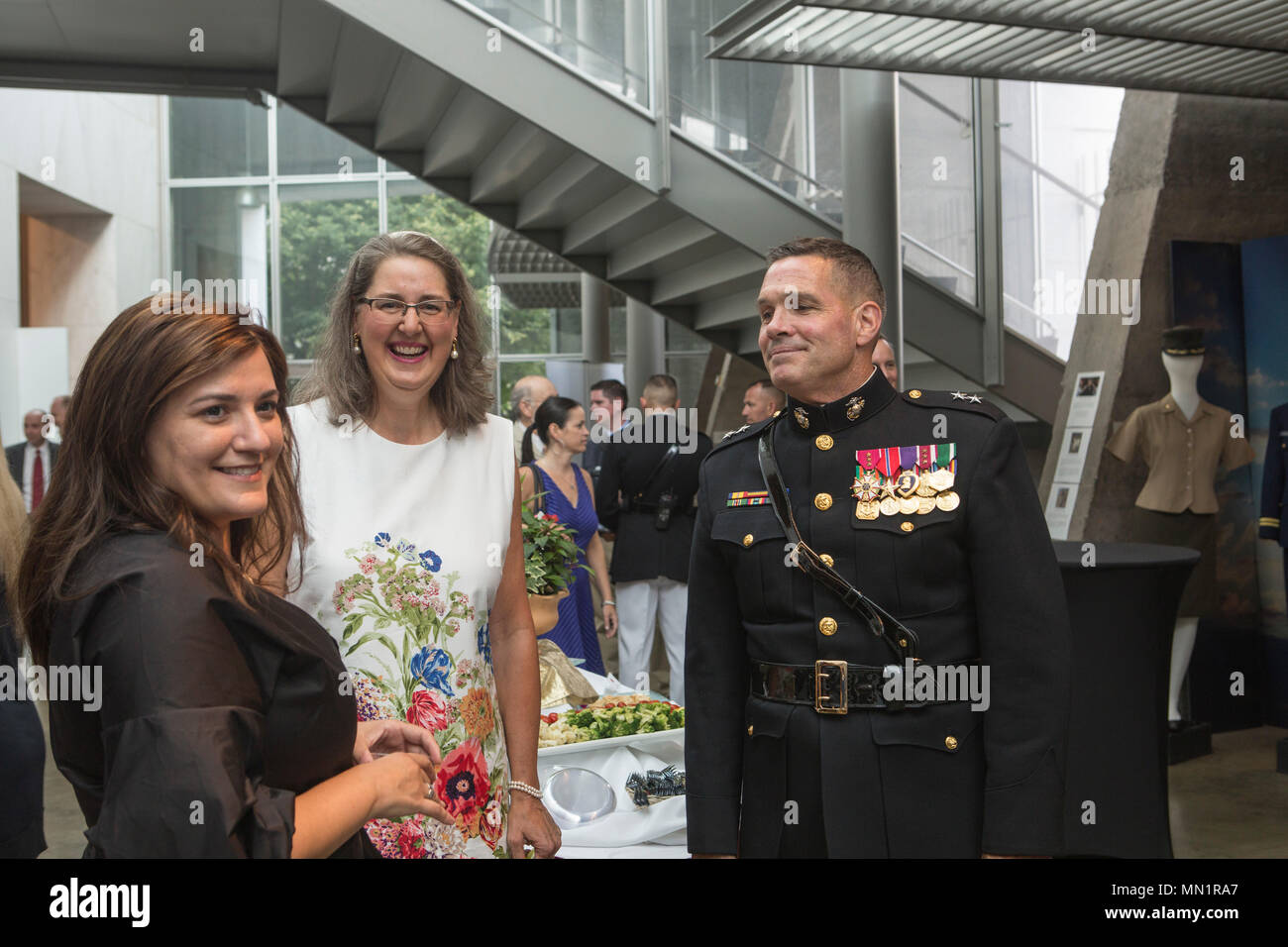 U.S. Marine Corps Maj Gen. John R. Ewers Jr., staff judge advocate to the Commandant, speaks with guests during a sunset parade reception at the Women in Military Service for America Memorial, Arlington, Virginia, Aug 1, 2017. Sunset parades are held as a means of honoring senior officials, distinguished citizens and supporters of the Marine Corps. (U.S. Marine Corps photo by Lance Cpl. Stephon L. McRae) Stock Photo