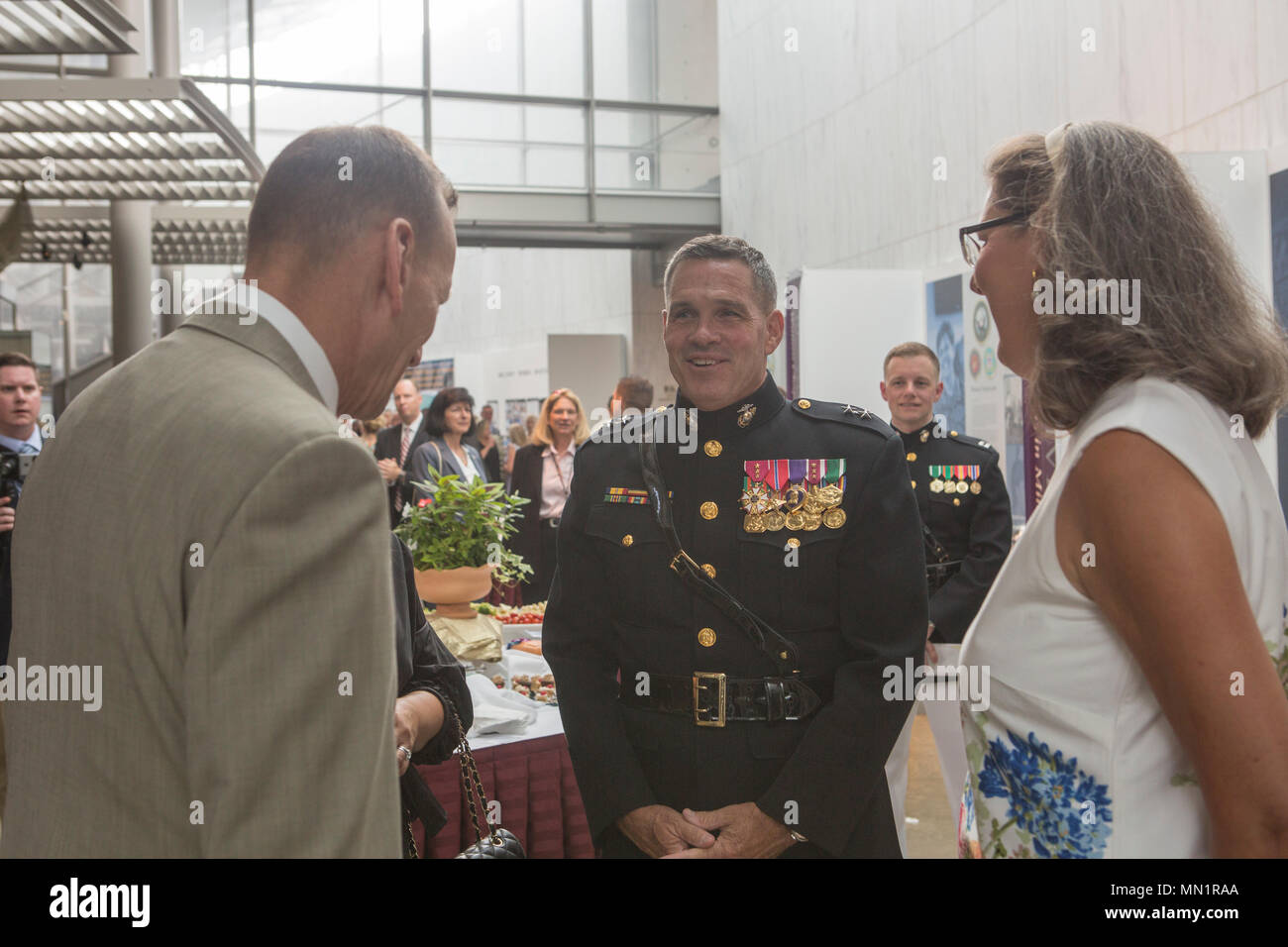 U.S. Marine Corps Maj Gen. John R. Ewers Jr., staff judge advocate to the Commandant, speaks with guests during a sunset parade reception at the Women in Military Service for America Memorial, Arlington, Virginia, Aug 1, 2017. Sunset parades are held as a means of honoring senior officials, distinguished citizens and supporters of the Marine Corps. (U.S. Marine Corps photo by Lance Cpl. Stephon L. McRae) Stock Photo
