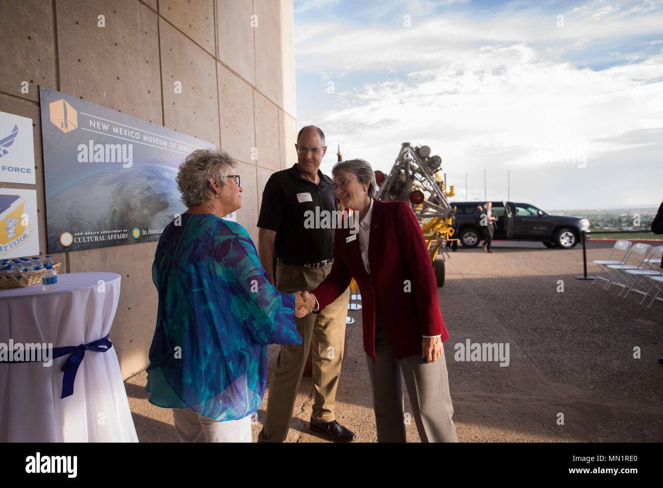 Secretary of the Air Force Heather Wilson is greeted by members of MainGate United, at the New Mexico Museum of Space history in Alamogordo, N.M., Aug. 8, 2017. Wilson came to Holloman Air Force Base and is here for a live-fly experiment with off-the-shelf aircraft. The Air Force is pursuing a Light Attack Capabilities Experimentation Campaign, which has grown out of our Close Air Support Experimentation Campaign. The Campaign is being led by the Air Force Strategic Development Planning and Experimentation Office under Air Force Materiel Command. (U.S. Air Force photo by Tech. Sgt. Amanda Junk Stock Photo