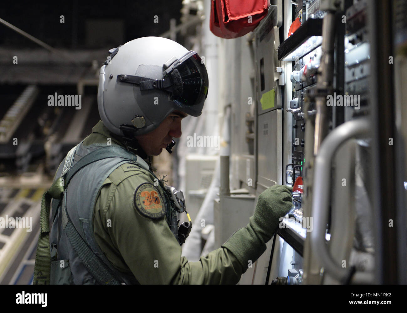 Royal Australian Air Force Sgt. Cameron Espley, loadmaster with the 36th Squadron RAAF, opens the ramp of a C-17 Globemaster III during Exercise Mobility Guardian at Joint Base Lewis-McChord, Wash., Aug. 10, 2017. More than 3,000 Airmen, Soldiers, Sailors, Marines and international partners converged on the state of Washington in support of Mobility Guardian. The exercise is intended to test the abilities of the Mobility Air Forces to execute rapid global mobility missions in dynamic, contested environments. Mobility Guardian is Air Mobility Command's premier exercise, providing an opportunity Stock Photo