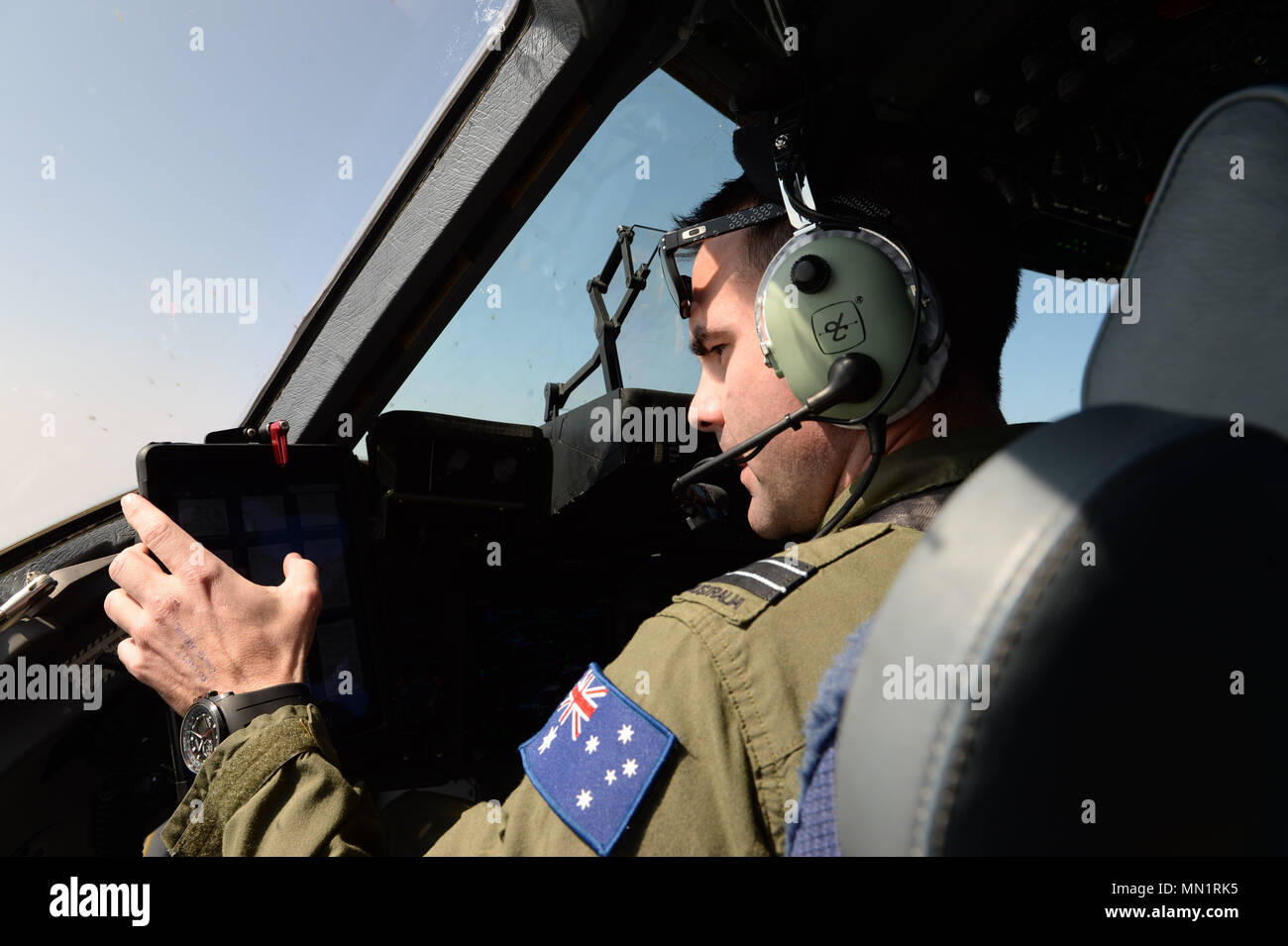 Royal Australian Air Force Flight Lt., Matthew Day, pilot with the 36th Squadron RAAF, flies a C