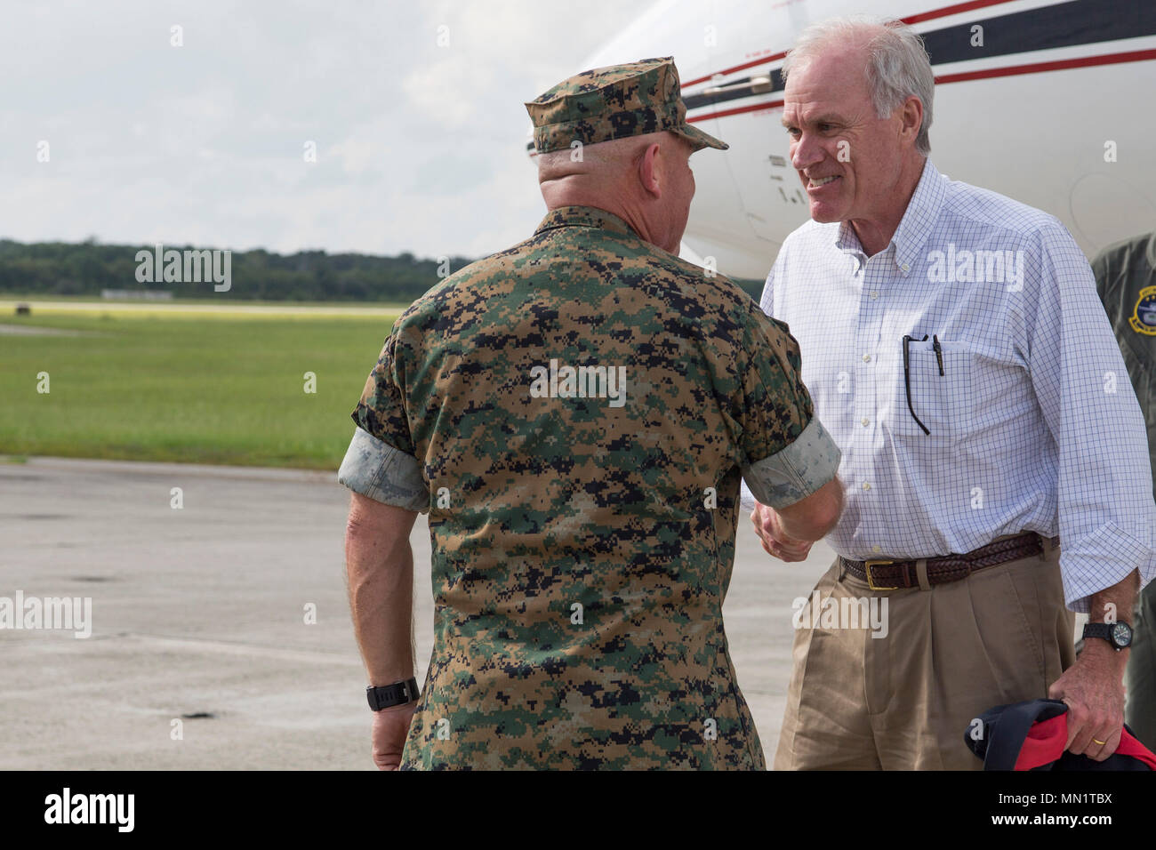 U.S. Marine Corps Brig. Gen. Austin E. Renforth, commanding general, Marine Corps Recruit Depot Parris Island and Eastern Recruiting Regions, greets Secretary of the Navy, Mr. Richard V. Spencer aboard Beaufort, S.C., Aug 10, 2017. Spencer is visiting MCAS Beaufort to tour VMFAT-501 and observe the F-35 aircraft. (Marine Corps photo by Lance Cpl. Erin R. Ramsay/ Released) Stock Photo