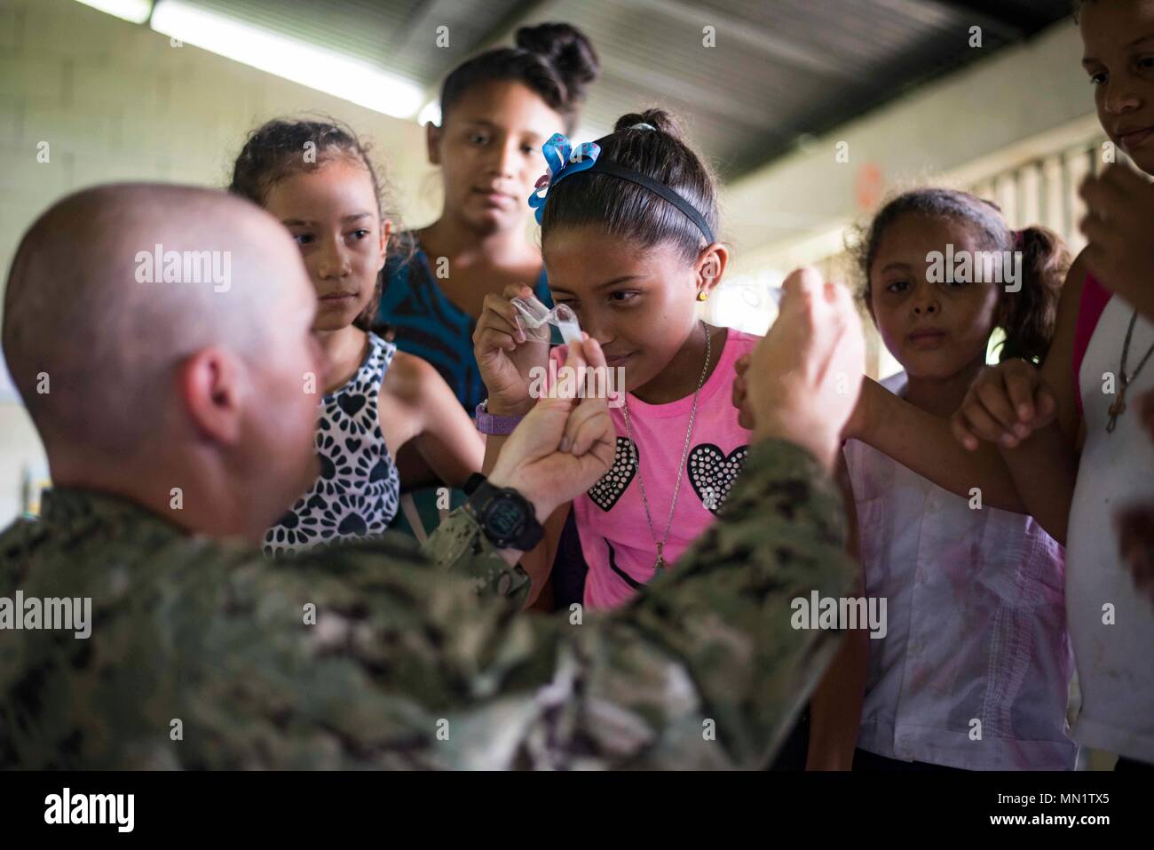 170810-N-KW679-0058 Tarros, Honduras (August 10, 2017) Lt. Cmdr. Ian Sutherland, technical director assigned to the Navy Entomology Center of Excellence, teaches students about entomology, during a Southern Partnership Station 17 community relations project (COMREL) at Escuela Rural Mixta Luz y Esperanza, a local elementary school. SPS 17 is a U.S. Navy deployment, executed by U.S. Naval Forces Southern Command/U.S. 4th Fleet, focused on subject matter expert exchanges with partner nation militaries and security forces in Central and South America. (U.S. Navy photo by Mass Communication Specia Stock Photo