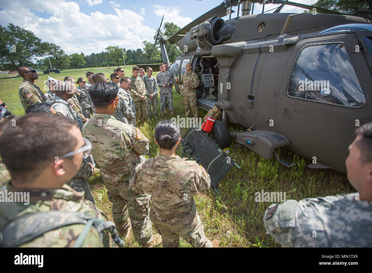 U.S. Army Reserve Sgt. Juan Rodriguez, 7158 Aviation Company, instructs U.S. Army Reserve Soldiers from the 328th Combat Support Hospital (CSH) and 349th CSH about how to properly approach a UH-60 Blackhawk helicopter during Combat Support Training Exercise (CSTX) 86-17-02 at Fort McCoy, Wis., August 10, 2017. CSTX includes more than 12,000 service members from the Army, Navy, Air Force and Marine Corps as well as from six countries. CSTX is a large-scale training event where units experience tactical training scenarios specifically designed to replicate real-world missions. (U.S. Army Reserve Stock Photo