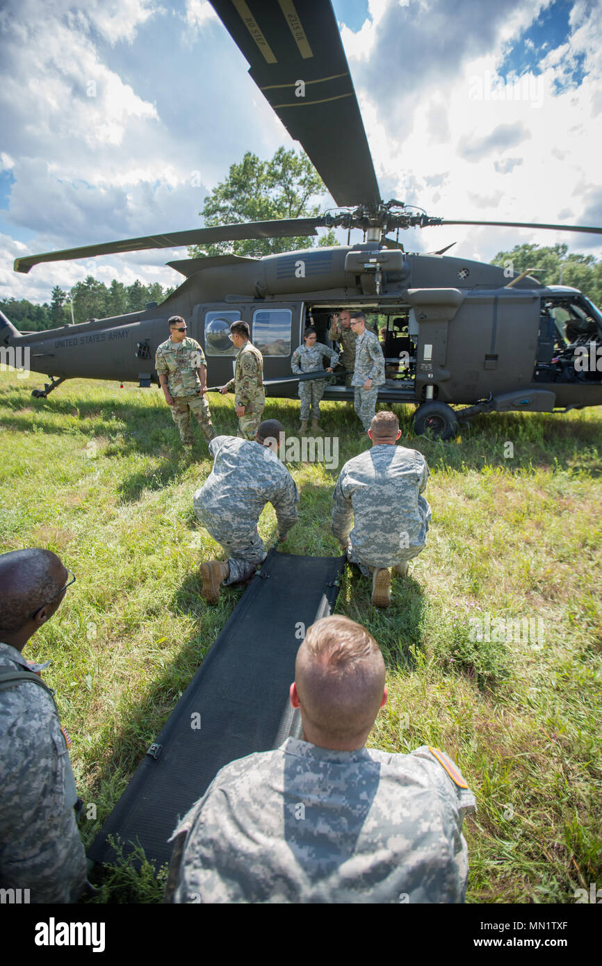 U.S. Army Reserve Soldiers from the 328th Combat Support Hospital (CSH) and 349th CSH practice cold-load techniques during Combat Support Training Exercise (CSTX) 86-17-02 at Fort McCoy, Wis., August 10, 2017. Cold-load litter techniques practice carrying an empty litter. CSTX includes more than 12,000 service members from the Army, Navy, Air Force and Marine Corps as well as from six countries. CSTX is a large-scale training event where units experience tactical training scenarios specifically designed to replicate real-world missions. (U.S. Army Reserve photo by Spc. John Russell/Released) Stock Photo