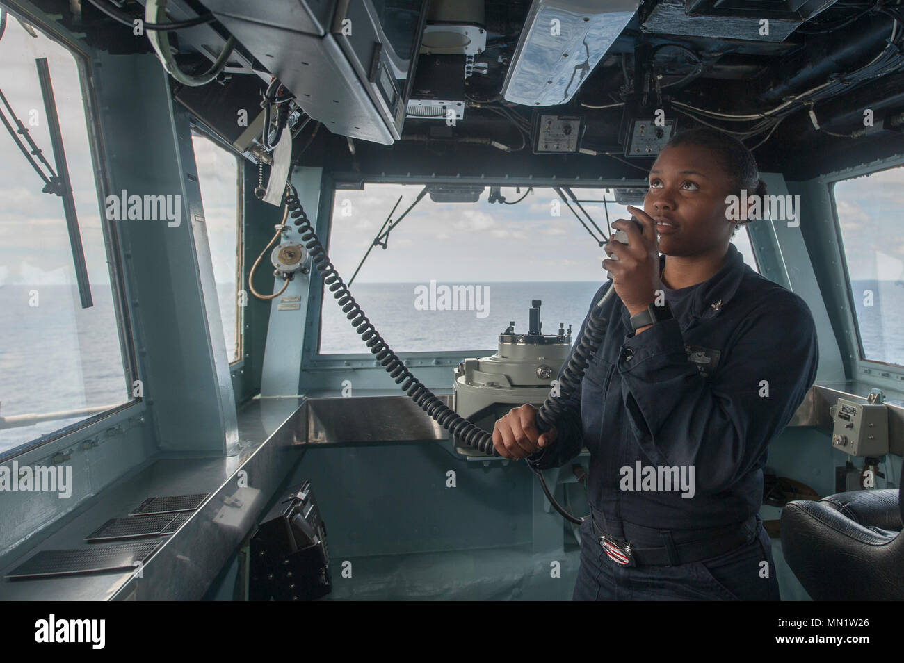 170810-N-ZS023-067 SOUTH CHINA SEA (Aug. 10, 2017) Quartermaster 2nd Class Taylor Nichols, a native of Valdosta, Georgia, assigned to the Navigation department aboard the amphibipus assault ship USS America (LHA 6), monitors the ship’s course in the bridge. America, part of the America Amphibious Ready Group, with embarked 15th Marine Expeditionary Unit, is operating in the Indo-Asia Pacific region to strengthen partnerships and serve as a ready-response force for any type of contingency. (U.S. Navy photo by Mass Communication Specialist Seaman Vance Hand/Released) Stock Photo