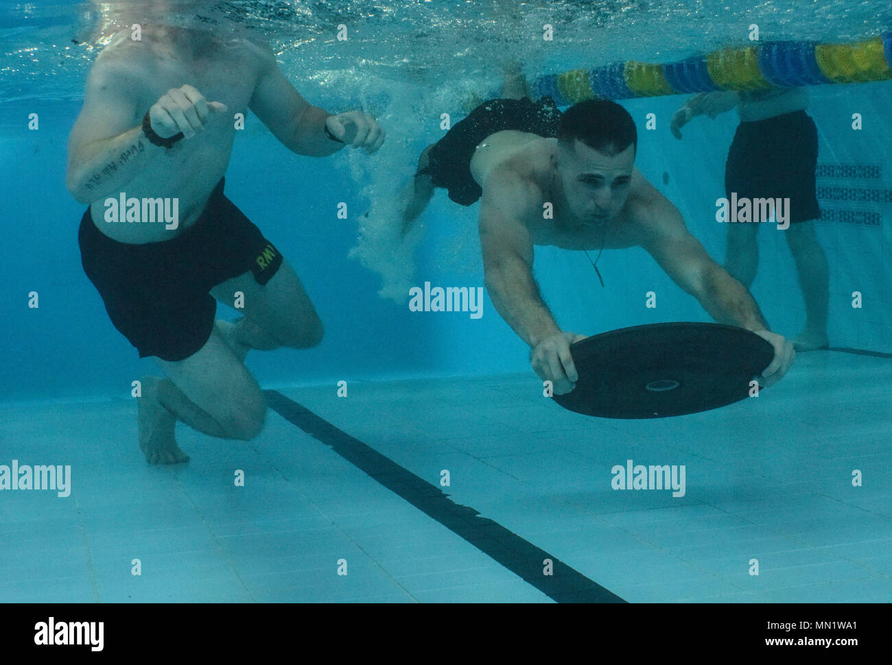 U.S. military members complete an underwater obstacle swim assessment