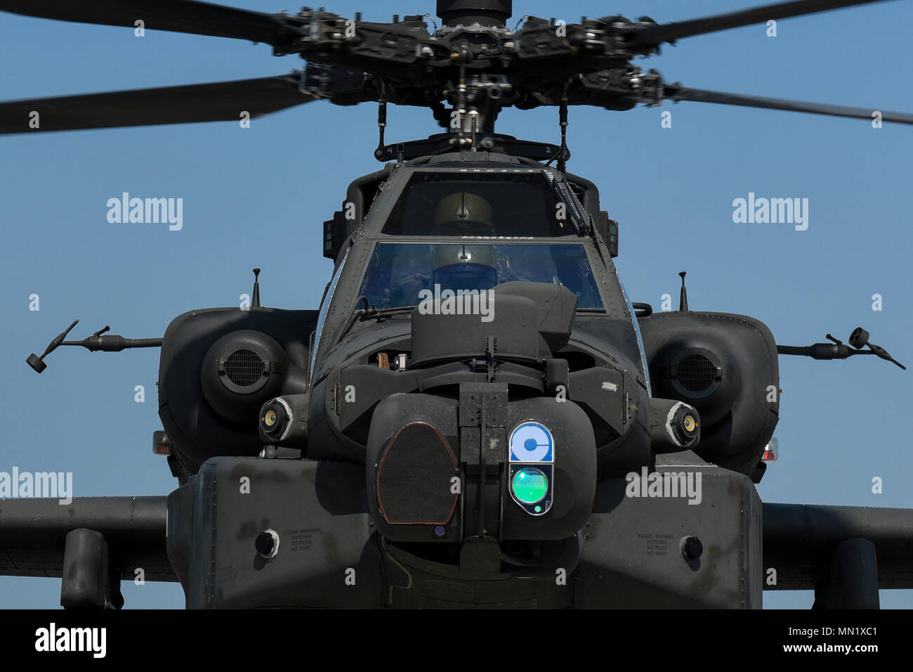 Soldiers with 4-2 Attack Reconnaissance Battalion, 2nd Combat Aviation Brigade piloting a U.S. Army AH-64 Apache helicopter wait to fuel at Kunsan Air Base, Republic of Korea, Aug. 7, 2017. The 2CAB Forward Arming and Refueling Point at Kunsan provided logistical support to the joint and combined, over-water live-fire exercise which enhances integration between ROK and U.S. Army and Airforce assets. (U.S. Air Force photo by Senior Airman Michael Hunsaker/released) Stock Photo