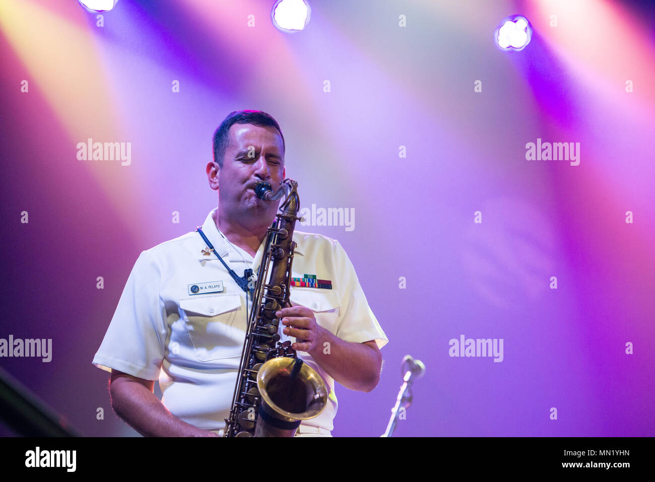 WICHITA FALLS, Texas (Aug. 14, 2017) Musician 1st Class Manuel Pelayo de Gongora performs with the U.S. Navy Band Cruisers popular music group at the Wichita Theater in Wichita Falls, Texas. The U.S. Navy Band performed in four states during its 14-city national tour, connecting the Navy to communities that don't see Sailors at work on a regular basis. (U.S. Navy photo by Chief Musician Adam Grimm/Released) Stock Photo