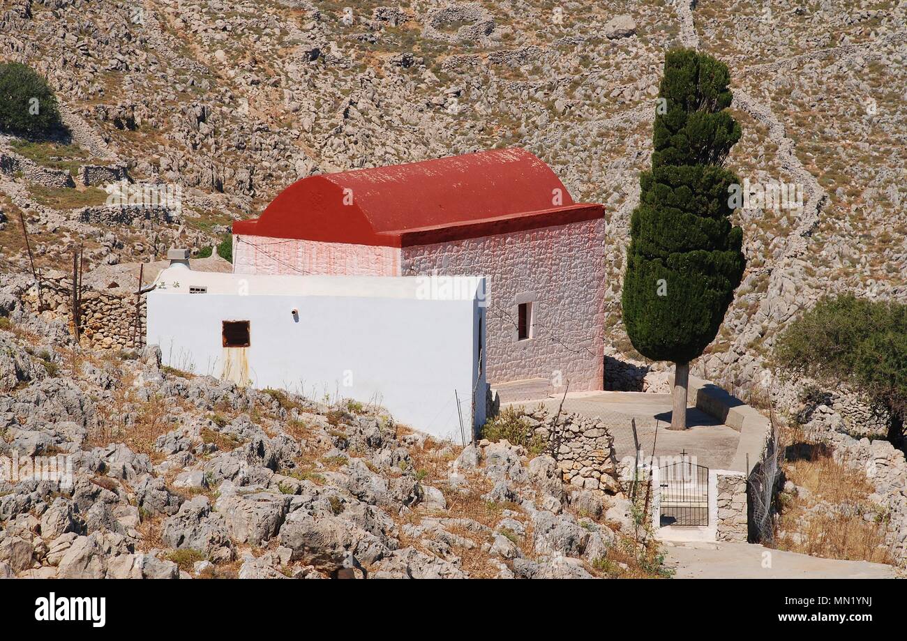 A chapel in the rocky hills near Chorio on the Greek island of Halki. Stock Photo