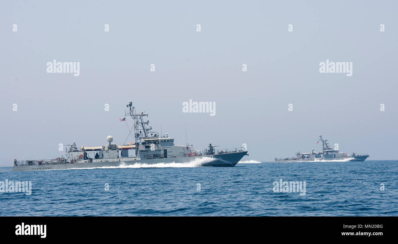 ARABIAN GULF (Aug. 9, 2017) The cyclone-class patrol coastal ship USS Hurricane (PC-3), left, and USS Thunderbolt (PC-12) participate in high-value asset escort training Aug. 9 2017. Exercise Spartan Kopis is a Task Force (TF) 55-led exercise between the U.S. Navy and U.S. Coast Guard in order to increase tactical proficiency, broaden levels of cooperation, enhance mutual capability and support long-term security and stability in the region (U.S. Navy photo by Mass Communication Specialist 2nd Class Sean Furey) Stock Photo