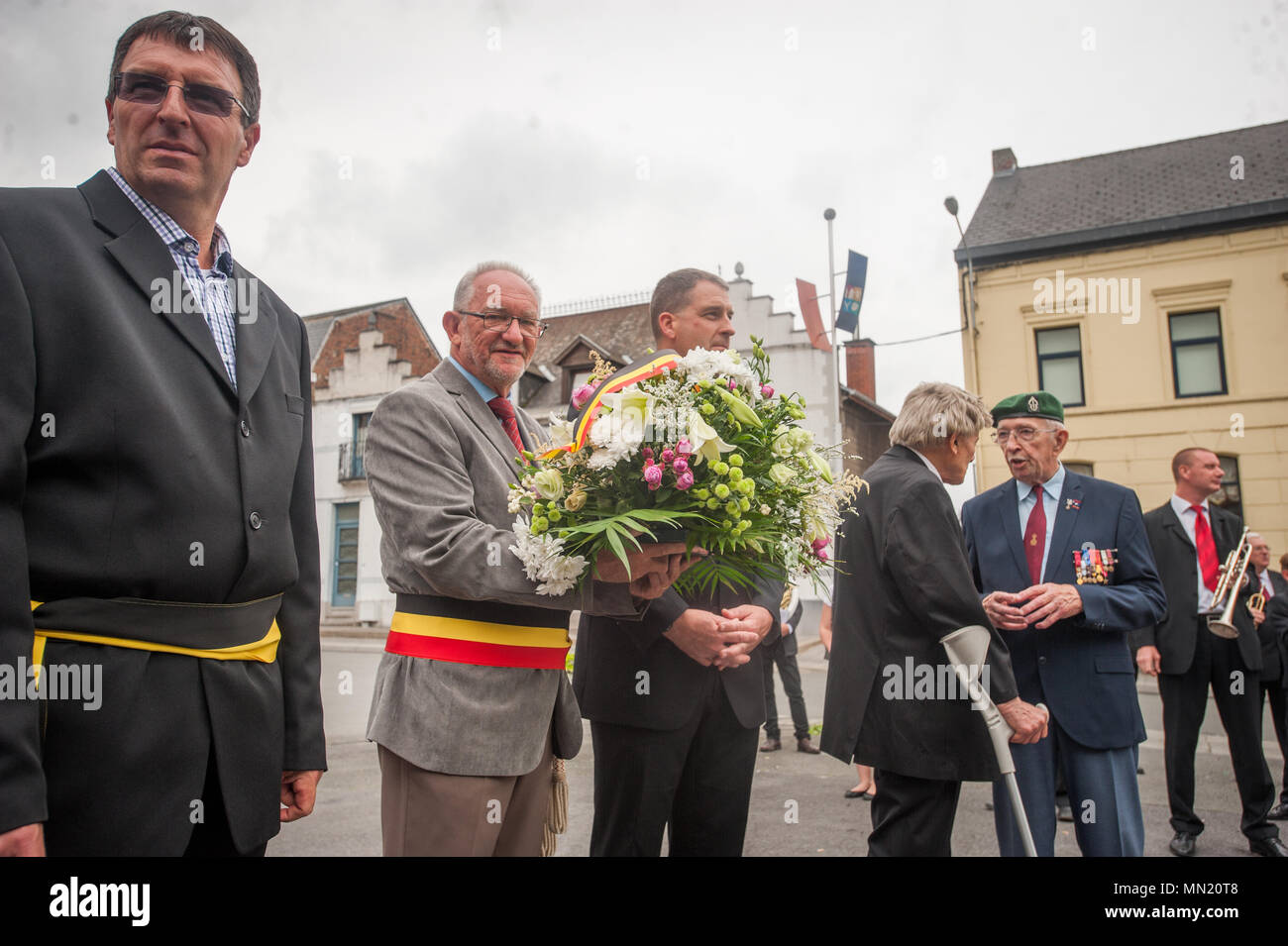 André Desmarlières, Mayor of Brugelette, Belgium and LTC Bill Lovell, Command Chaplain for USAG Benelux prepare to lay flowers at a monument during the memorial ceremony for Belgian Lt. Col. Joseph Daumerie, Aug. 15, 2017, Brugelette, Belgium. The memorial commemorates the 75th anniversary of Daumerie's death. Daumerie is a war hero and fighter pilot who was executed in 1942 during World War II. The event offered a unique opportunity for the U.S. service members to honor a fallen hero and strengthen their relationship with NATO allies during the U.S. Army Garrison Benelux's 50th anniversary in Stock Photo