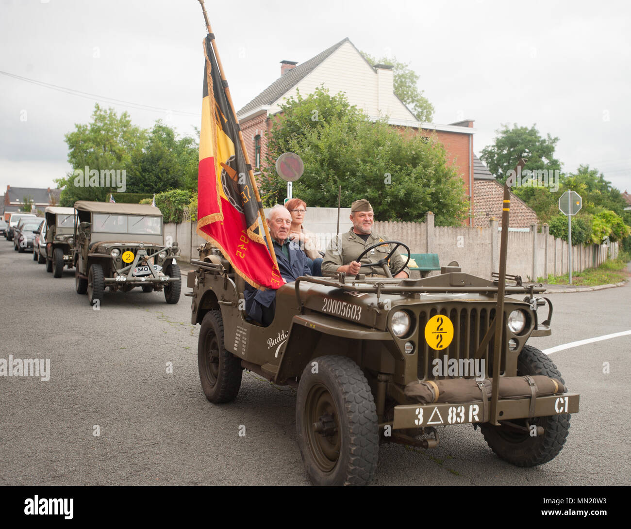 Participants drive in a march during the memorial ceremony for Belgian Lt. Col. Joseph Daumerie, Aug. 15, 2017, Brugelette, Belgium. The memorial commemorates the 75th anniversary of Daumerie's death. Daumerie is a war hero and fighter pilot who was executed in 1942 during World War II. The event offered a unique opportunity for the U.S. service members to honor a fallen hero and strengthen their relationship with NATO allies during the U.S. Army Garrison Benelux's 50th anniversary in Belgium. (U.S. Navy Photo by Information System Technician Seaman Daniel Gallegos/Released) Stock Photo