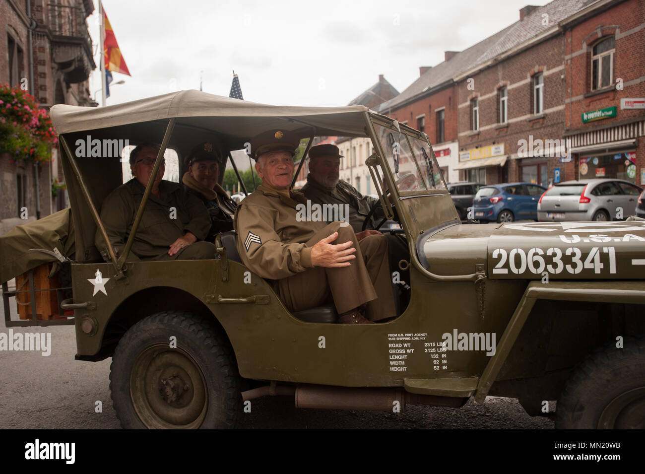 Participants drive in a march during the memorial ceremony for Belgian Lt. Col. Joseph Daumerie, Aug. 15, 2017, Brugelette, Belgium. . The memorial commemorates the 75th anniversary of Daumerie's death. Daumerie is a war hero and fighter pilot who was executed in 1942 during World War II. The event offered a unique opportunity for the U.S. service members to honor a fallen hero and strengthen their relationship with NATO allies during the U.S. Army Garrison Benelux's 50th anniversary in Belgium. (U.S. Navy Photo by Information System Technician Seaman Daniel Gallegos/Released) Stock Photo