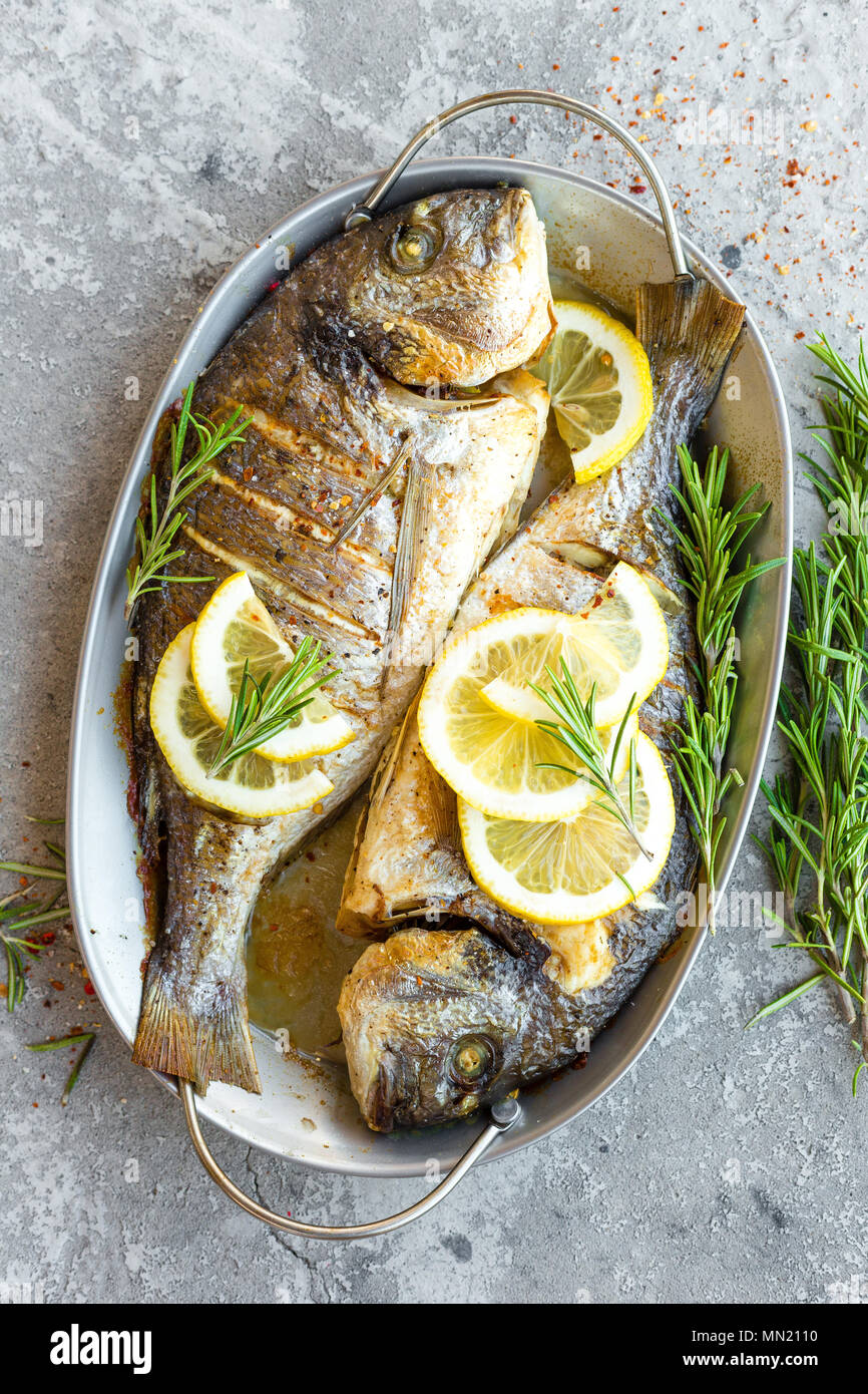 Baked fish dorado. Sea bream or dorada fish grilled Stock Photo Alamy