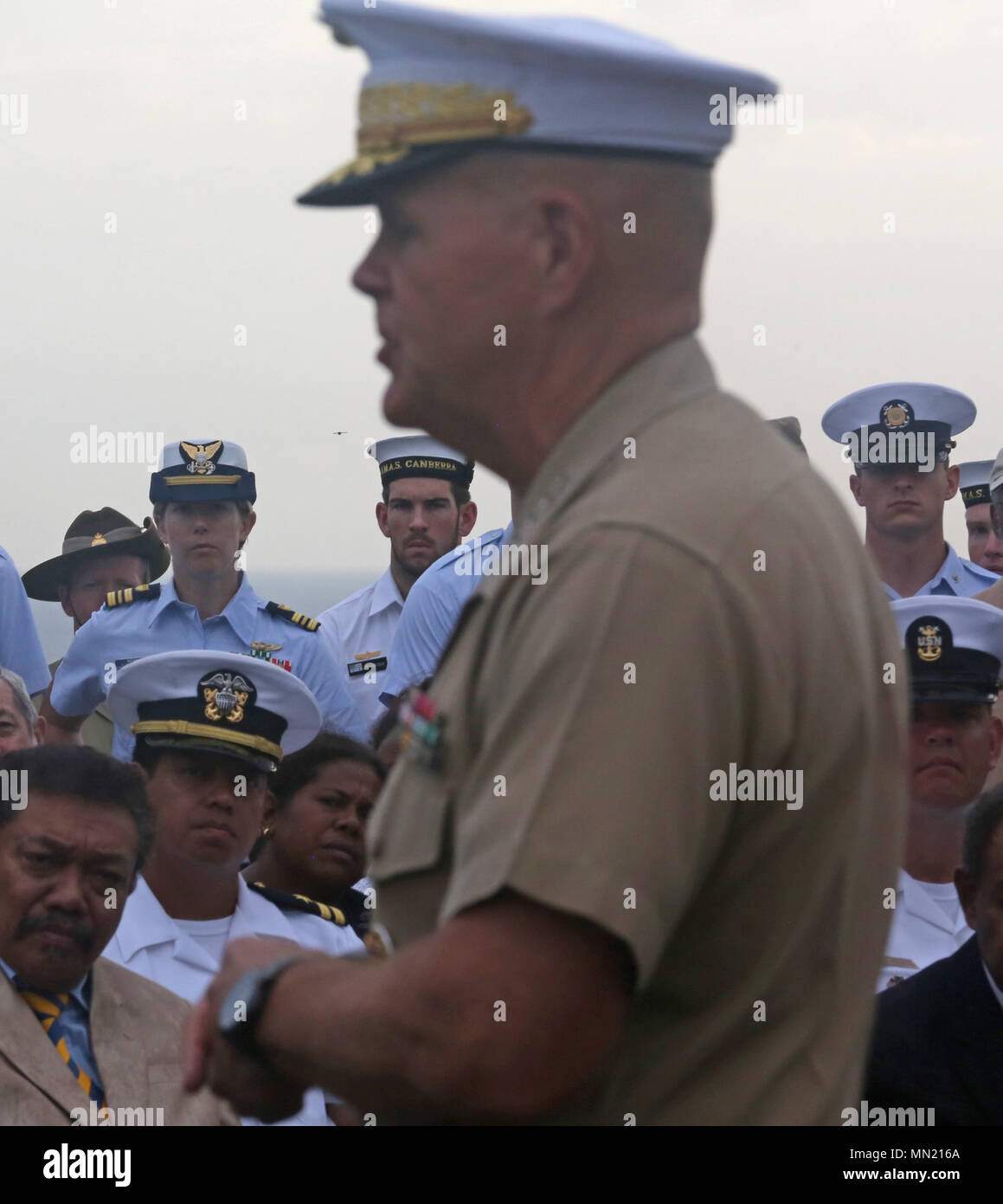 Military personnel and guests listen as Commandant of the Marine Corps ...