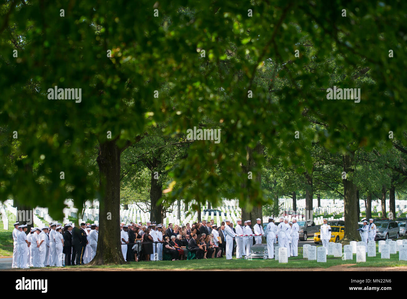 The U.S. Navy Ceremonial Guard participates in the graveside service for U.S. Navy Fire Controlman Chief Gary Leo Rehm Jr. at Arlington National Cemetery, Arlington, Va, Aug. 14, 2017.  Rehm perished when the USS Fitzgerald (DDG 62) was involved in a collision with the Philippine-flagged merchant vessel ACX Crystal on June 17, 2017.  U.S. Navy  posthumously promoted Rehm to Fire Controlman Chief in a ceremony earlier this week. (U.S. Army photo by Elizabeth Fraser / Arlington National Cemetery / released) Stock Photo