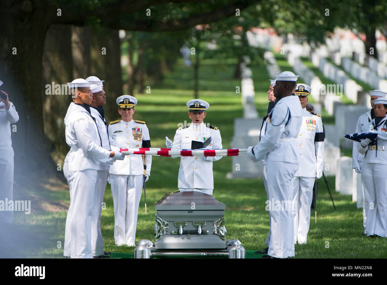 The U.S. Navy Ceremonial Guard participates in the graveside service for U.S. Navy Fire Controlman Chief Gary Leo Rehm Jr. at Arlington National Cemetery, Arlington, Va, Aug. 14, 2017.  Rehm perished when the USS Fitzgerald (DDG 62) was involved in a collision with the Philippine-flagged merchant vessel ACX Crystal on June 17, 2017.  U.S. Navy  posthumously promoted Rehm to Fire Controlman Chief in a ceremony earlier this week. (U.S. Army photo by Elizabeth Fraser / Arlington National Cemetery / released) Stock Photo