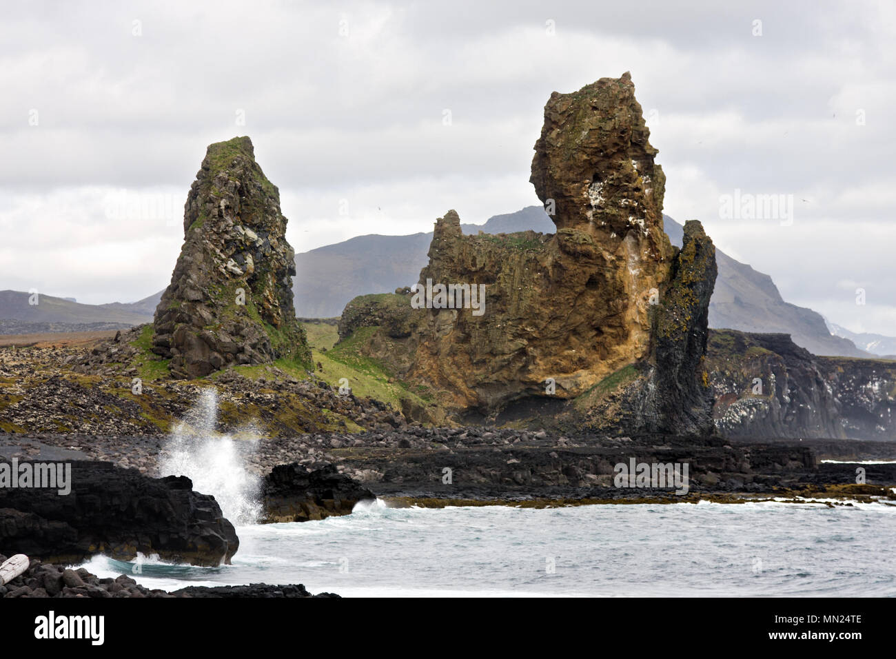 These volcanic rocks are located on the south side of the Snaefellsnes peninsula in Iceland and are up to 70m tall. Stock Photo