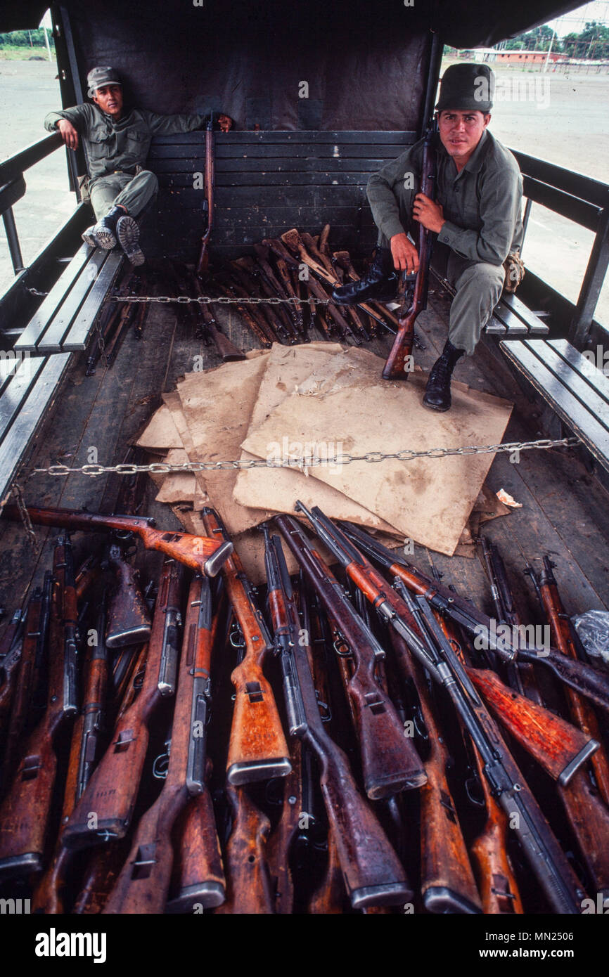 Managua, Nicaragua, July 1981; Soldiers delivering old rifles for a